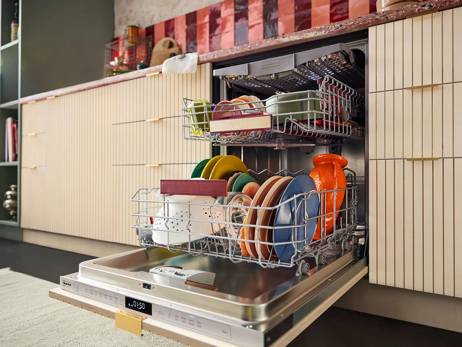 A modern dishwasher with colorful dishes, set against a stylish kitchen backdrop with wooden cabinetry.
