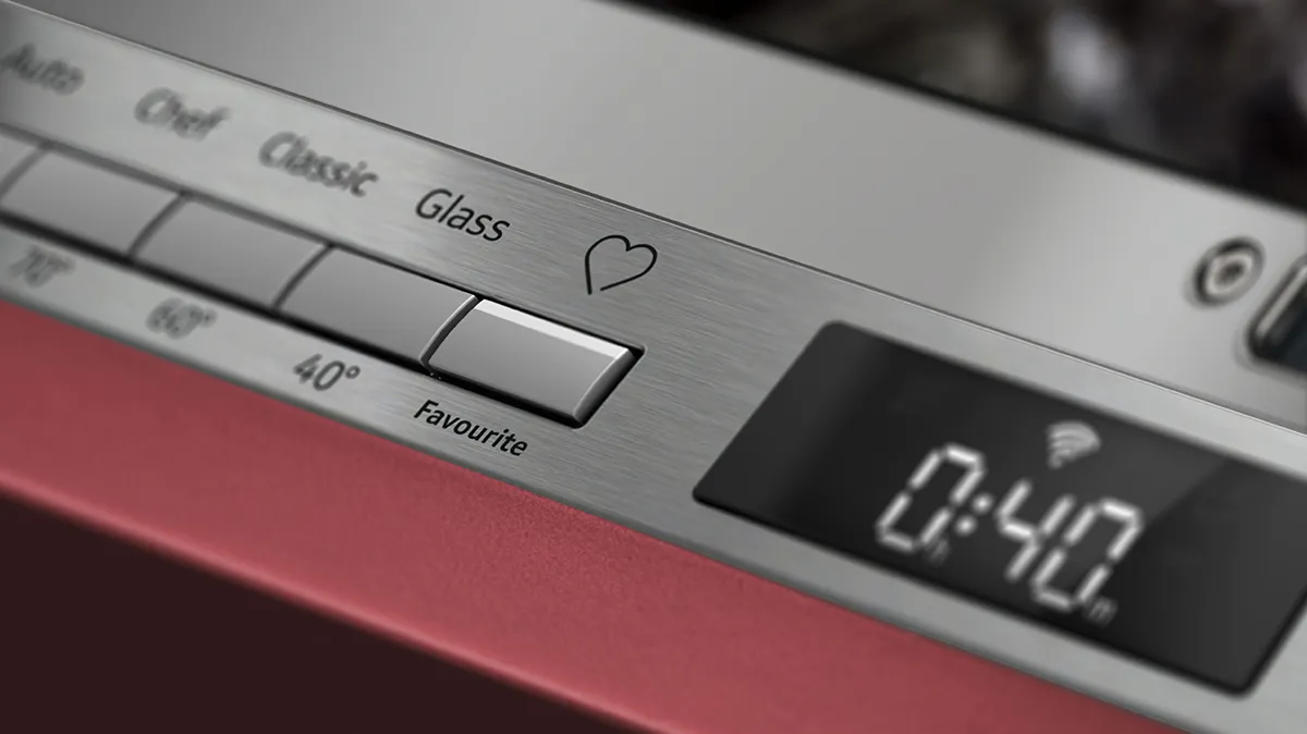 Close-up of a modern kitchen appliance control panel featuring buttons for settings, a heart icon, and a timer display showing 0:40.