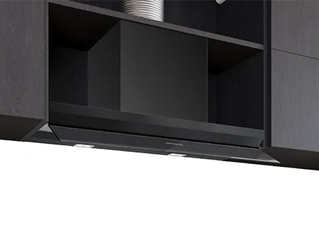 A sleek black range hood mounted below kitchen cabinetry, featuring subtle lights and an integrated design