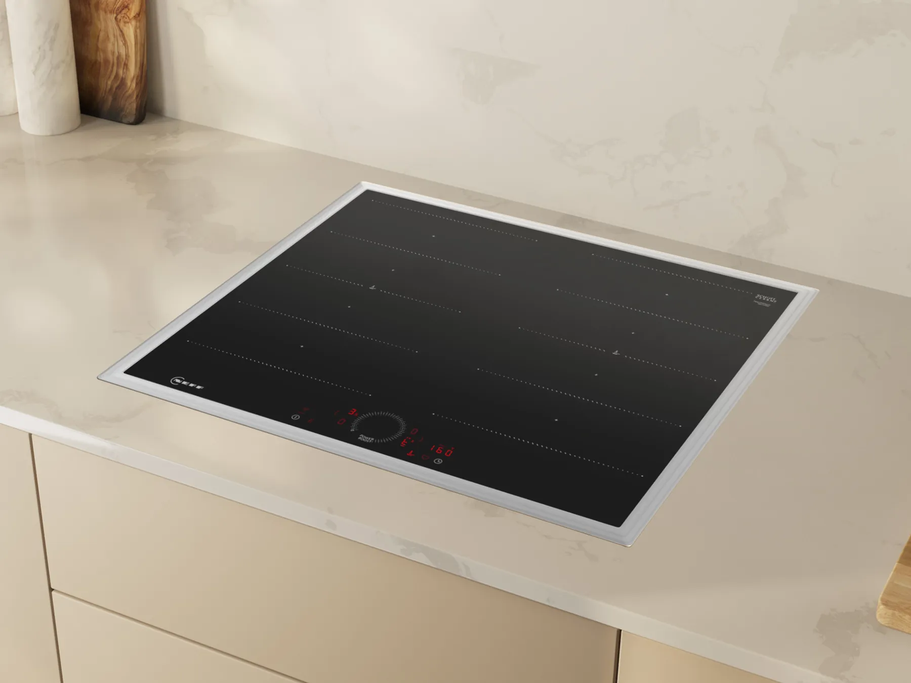 Ein modernes, schwarzes Induktionskochfeld mit Touch-Bedienung, eingelassen in eine stilvolle beige Arbeitsplatte. Die perfekte Wahl für deine zeitgemäße Küche.