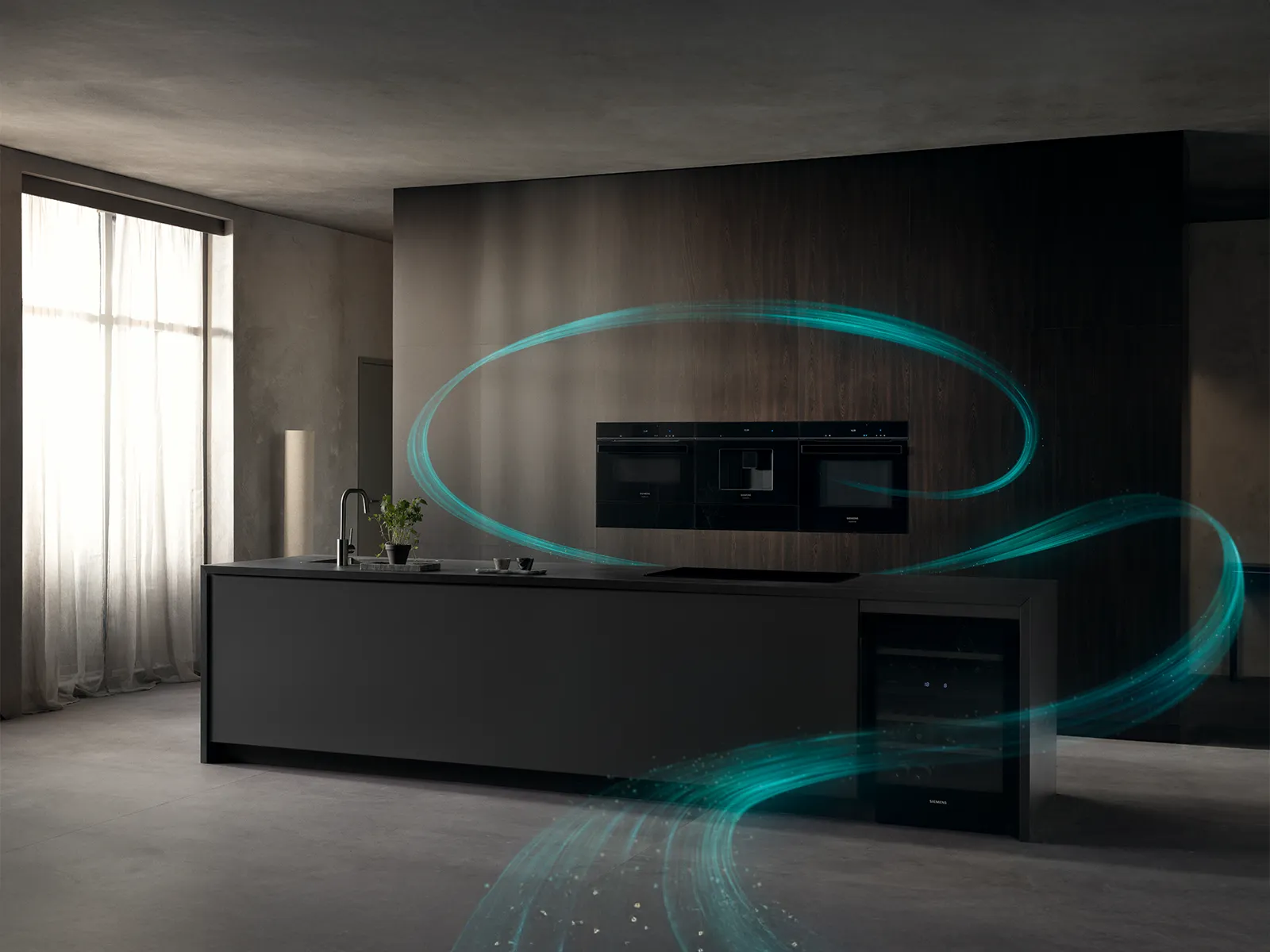 A man and woman sitting at a table discussing a kitchen design that is displayed on a smart tablet.