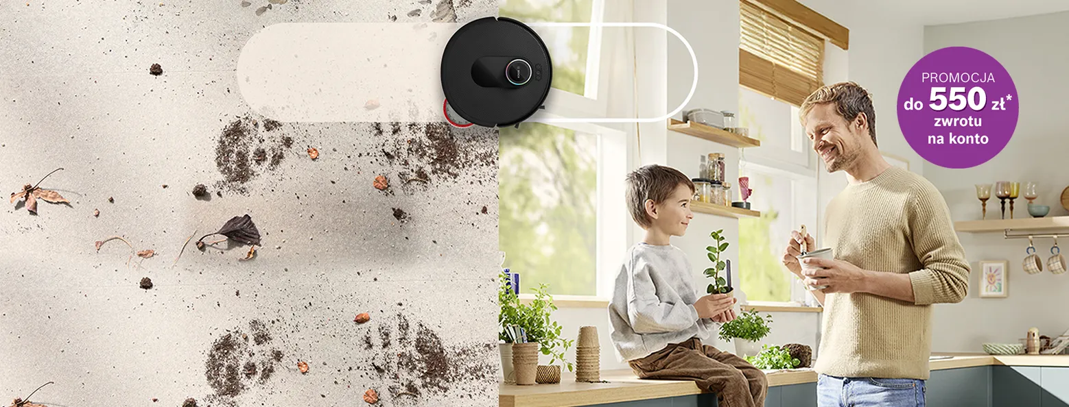 robot sprzątający, obok mężczyzna i chłopiec w kuchni