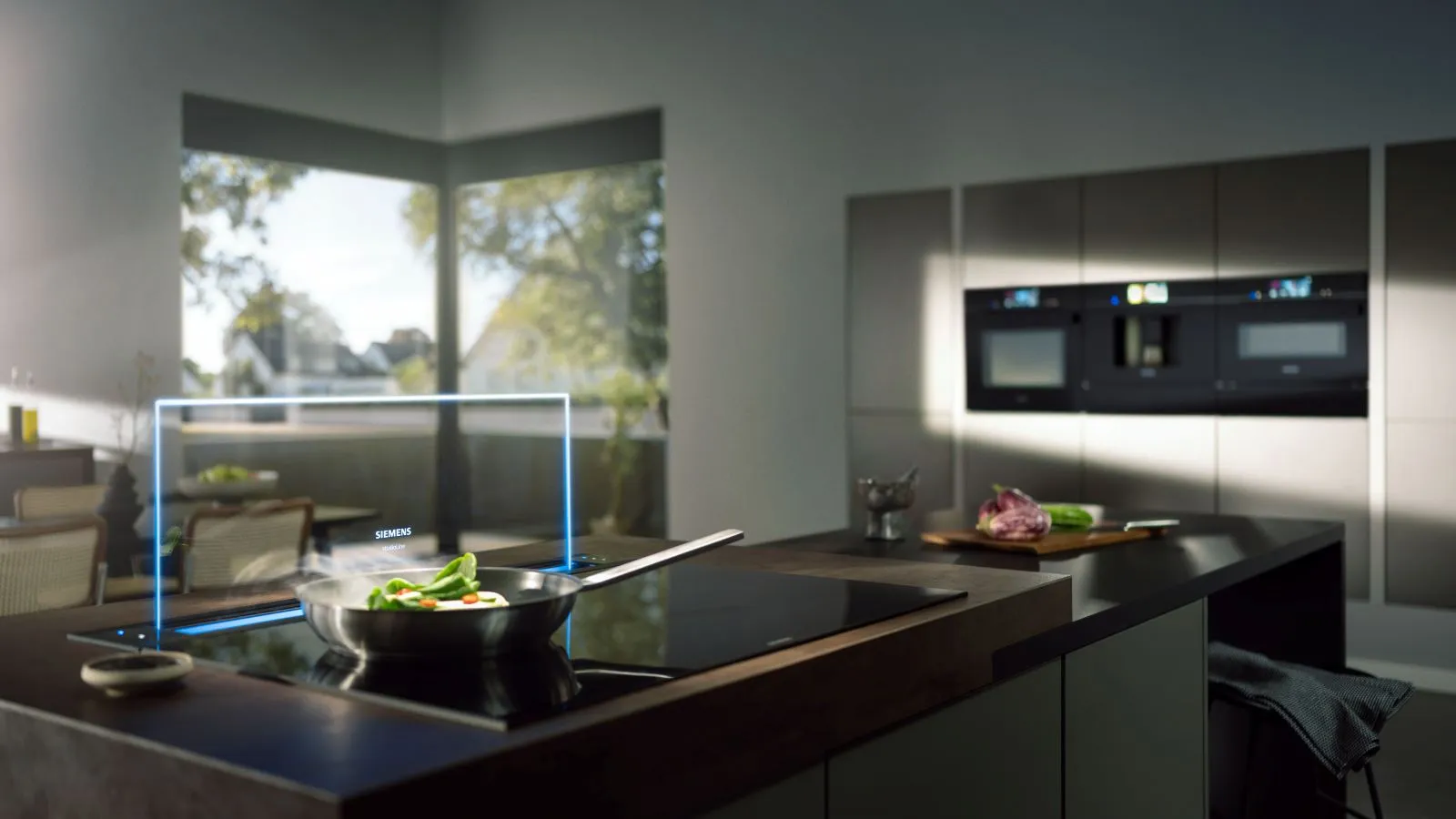 Light and open kitchen living area with numerous Siemens appliances