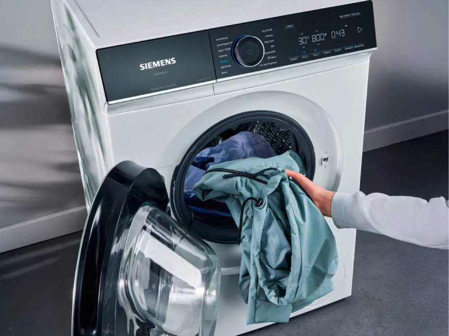 washing being removed from the machine