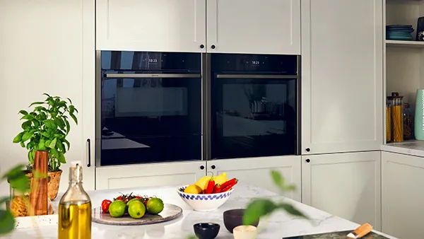 Light and colourful kitchen with two NEFF built in ovens