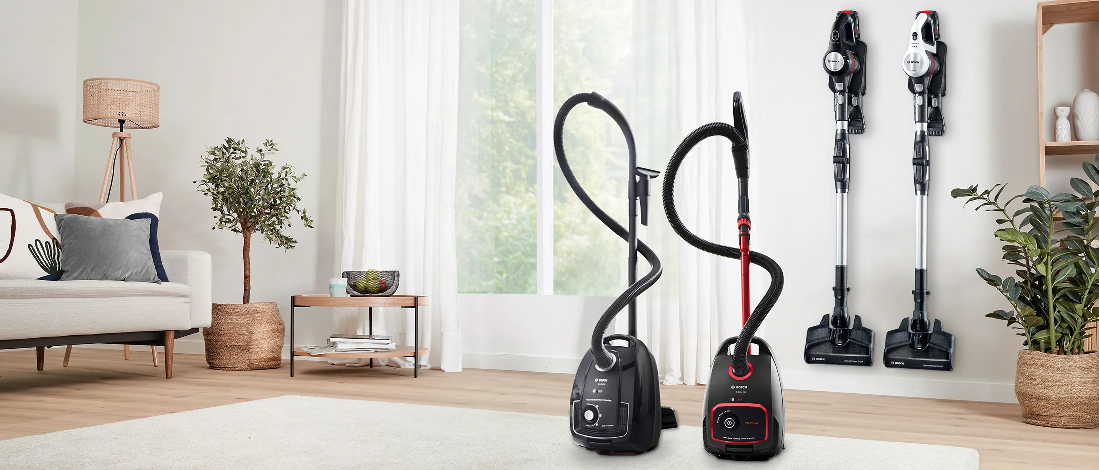 Person using a Bosch vacuum cleaner flex tube feature. 