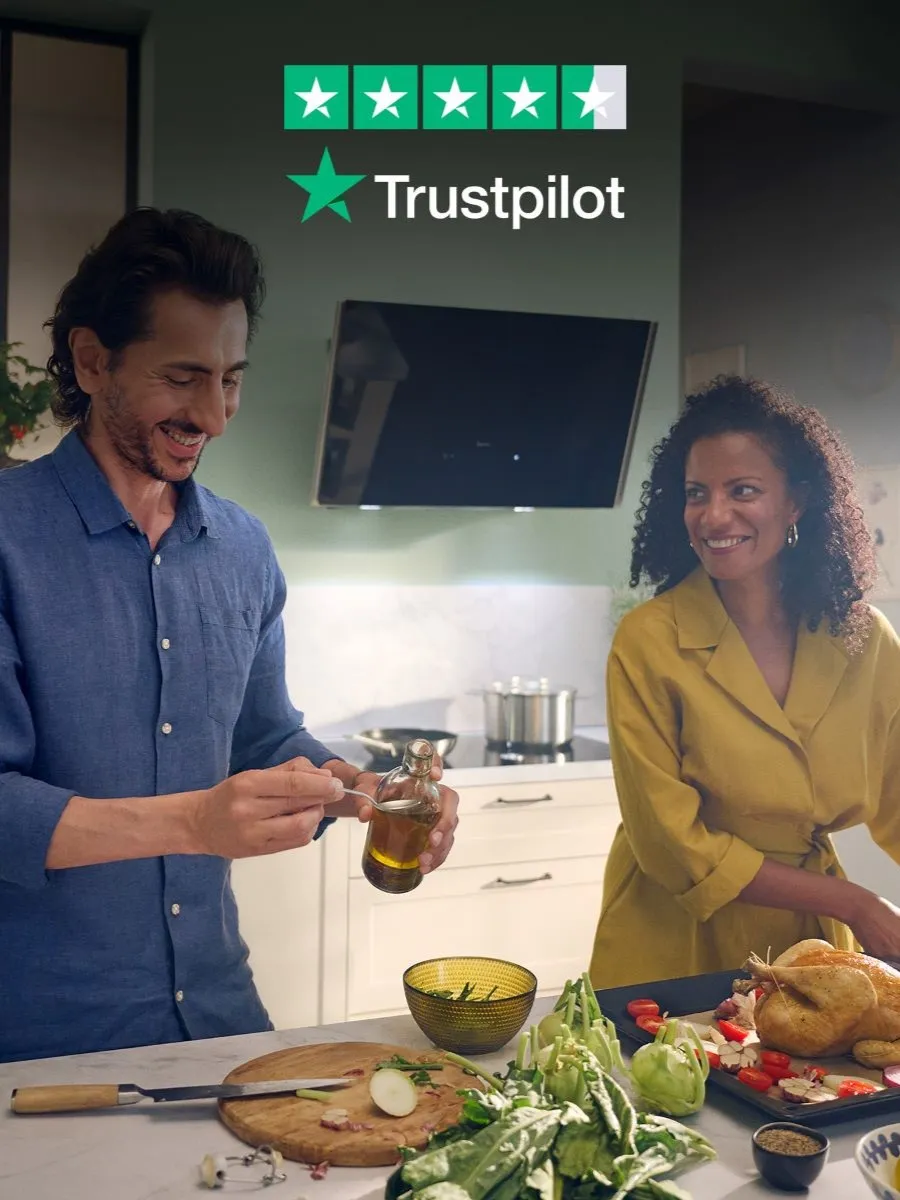 People prepping food in kitchen with Trustpilot icon overlay
