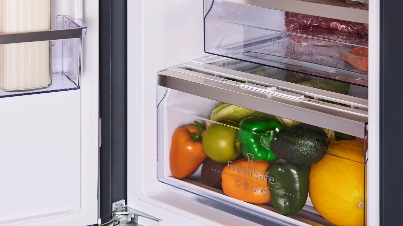 Different colourful vegetables all together in fridge drawer