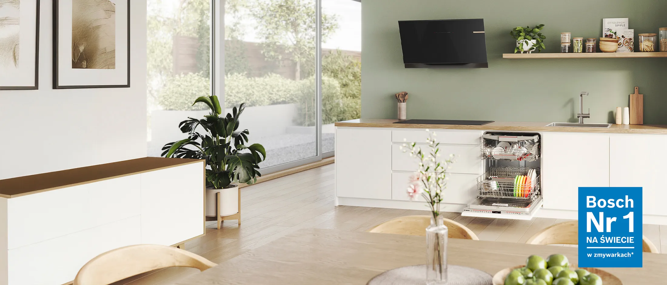 Nowoczesna kuchnia z otwartą zmywarką załadowaną czystymi naczyniami.