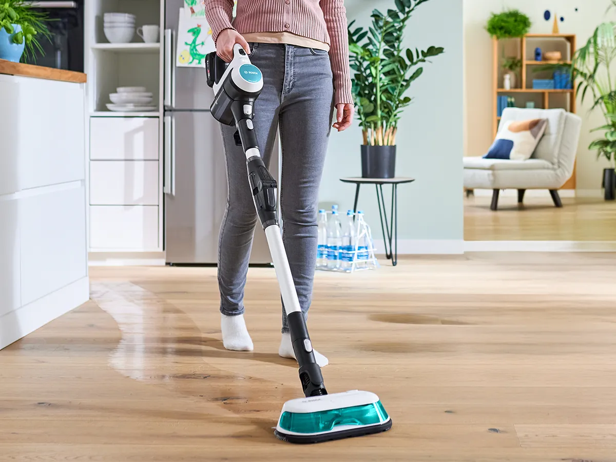 Prohygienic Aqua mop being used to clean wooden floor.