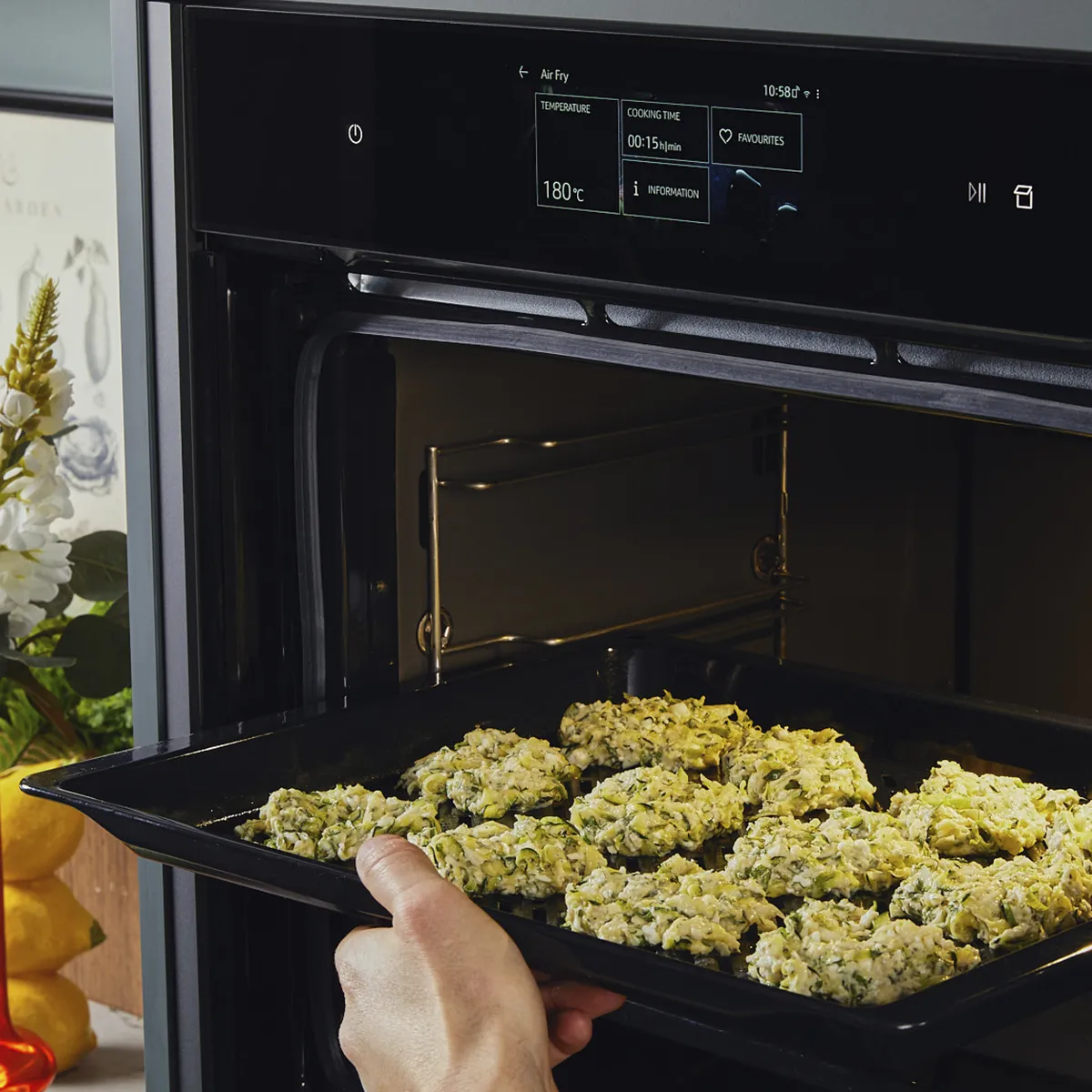 Transferring zucchini fritters to an oven