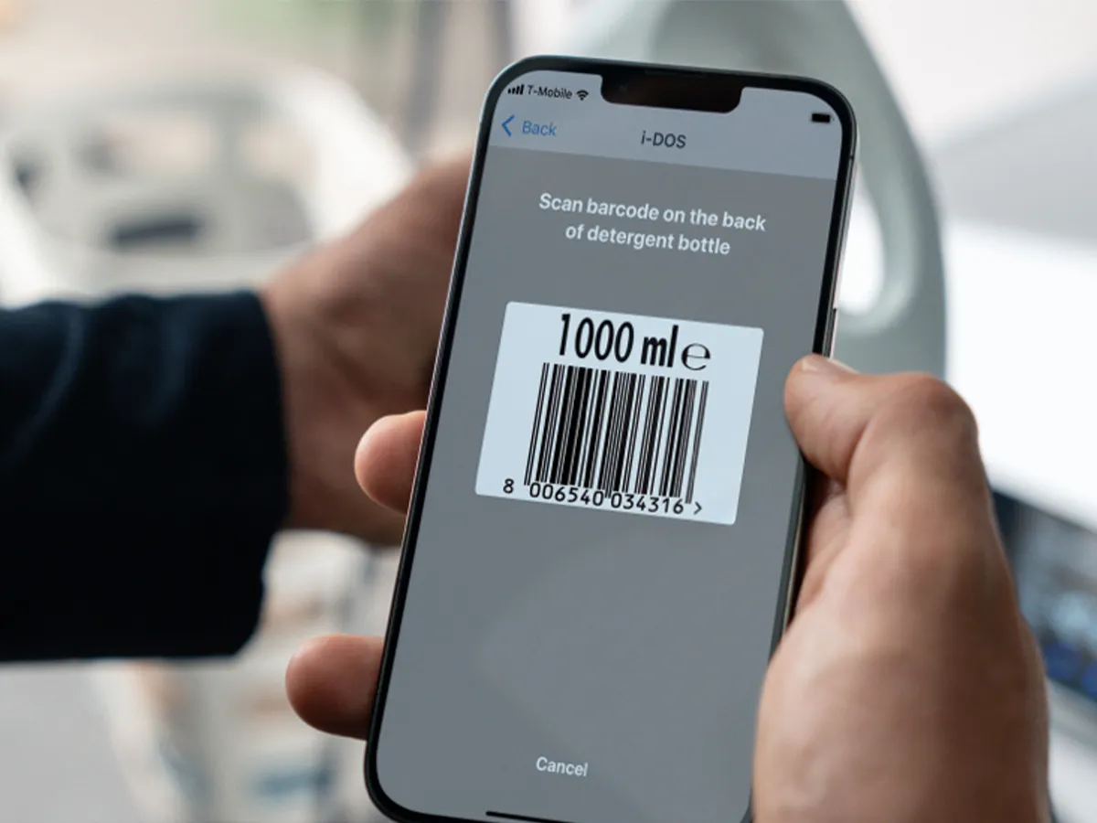 Person using home connect to scan detergent bottle