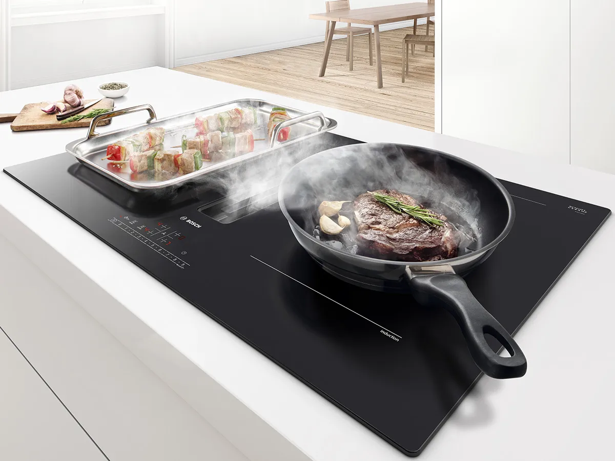 Vented induction cooktop at work.
