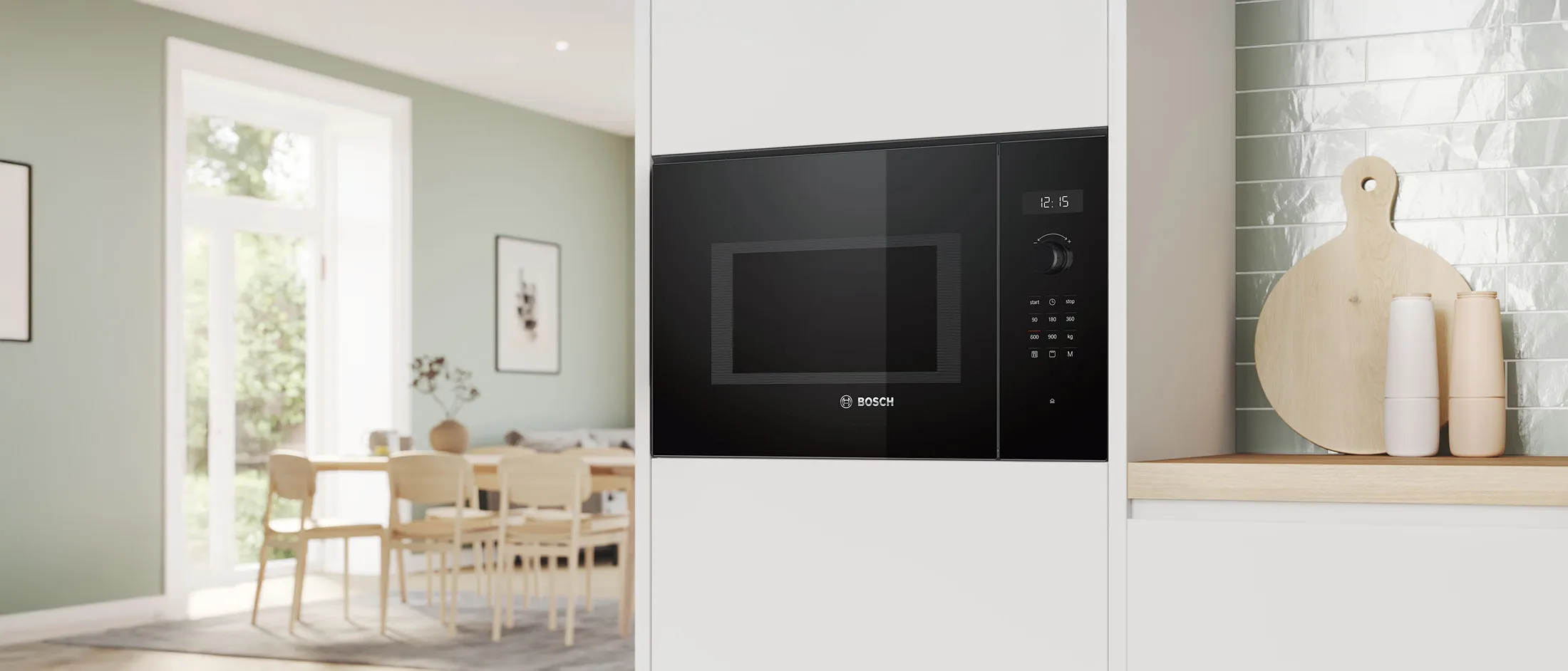 Black built-in Bosch microwave integrated in a white kitchen cabinet.