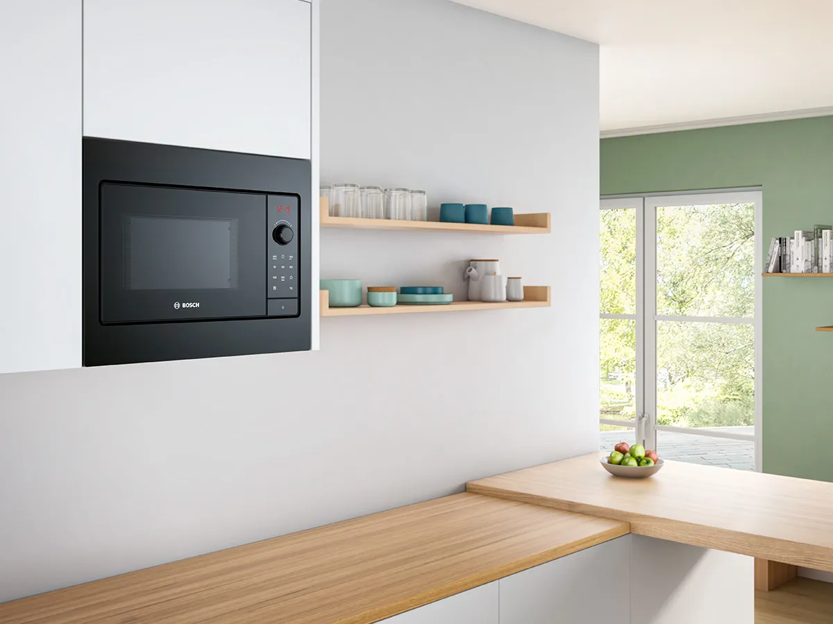 View of kitchen island with built in Bosch microwave.