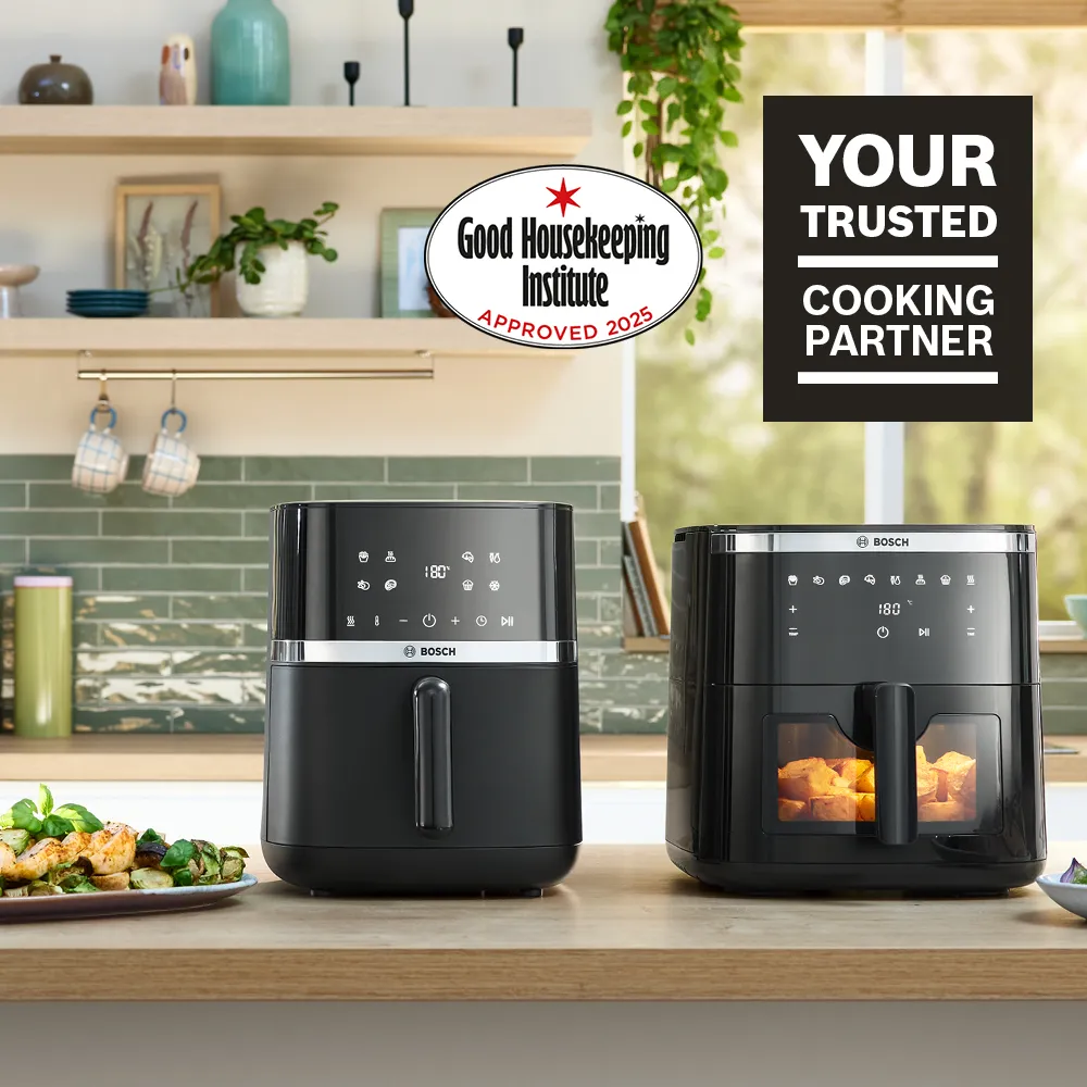 Air fryer models on kitchen counter with Good Housekeeping badge