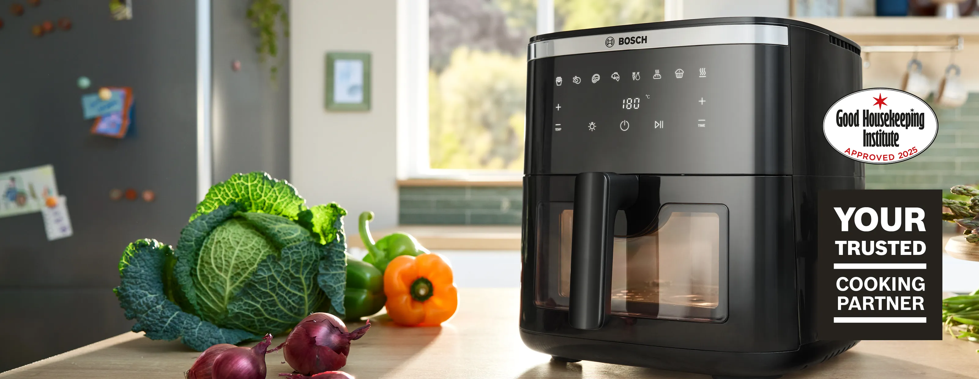 A Bosch Air Fryer Series 6 is positioned on a bright kitchen counter, viewed from the front, showcasing its modern design.