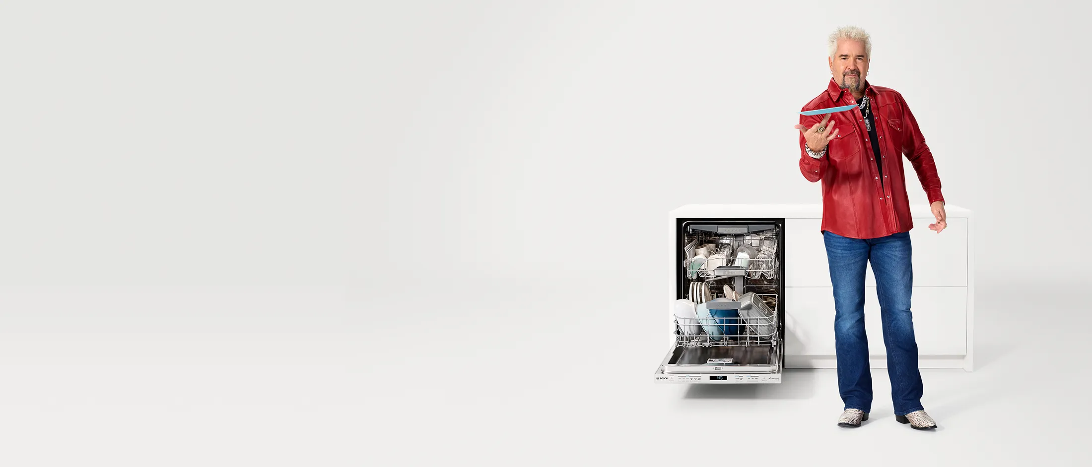 Open Dishwasher with Guy Fieri standing beside it