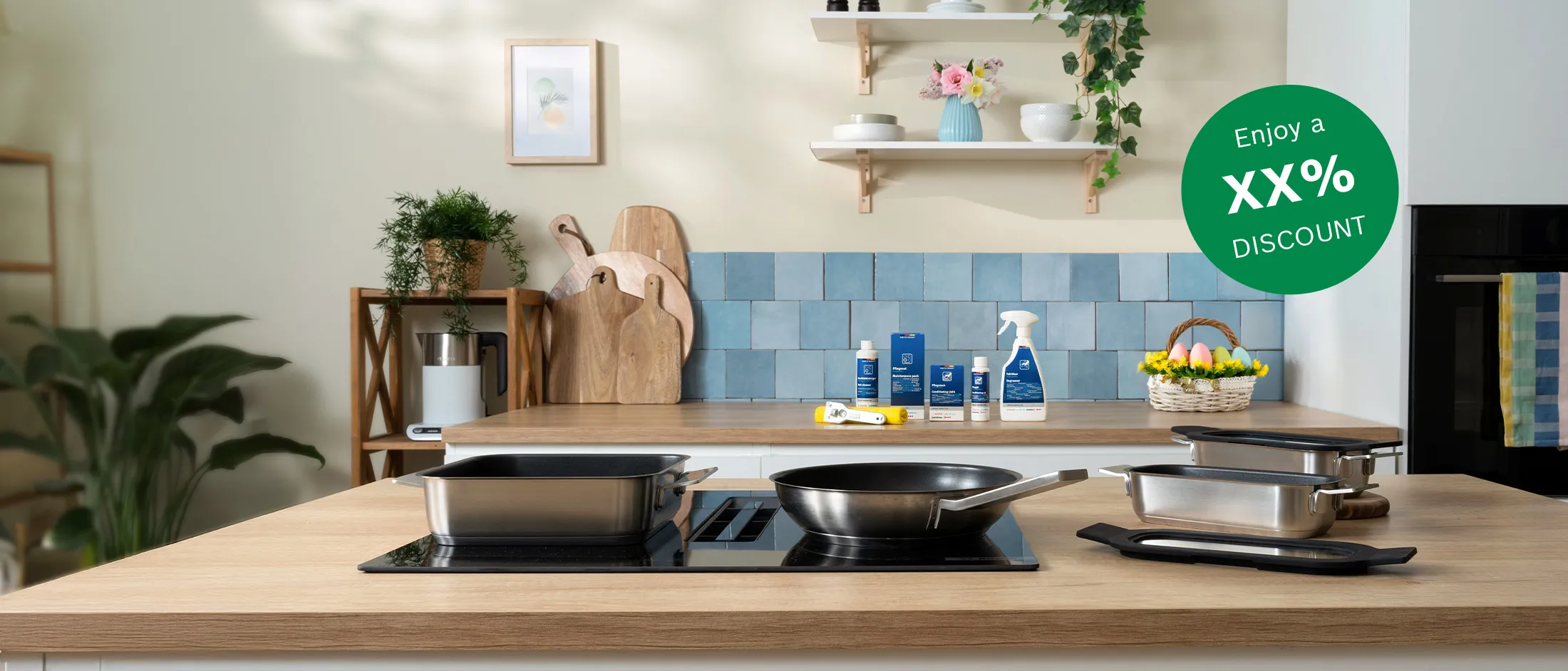 Modern kitchen countertop with stainless cookware on stovetop, blue tile backsplash, wood boards, potted plant, cleaners and an egg basket plus badge.