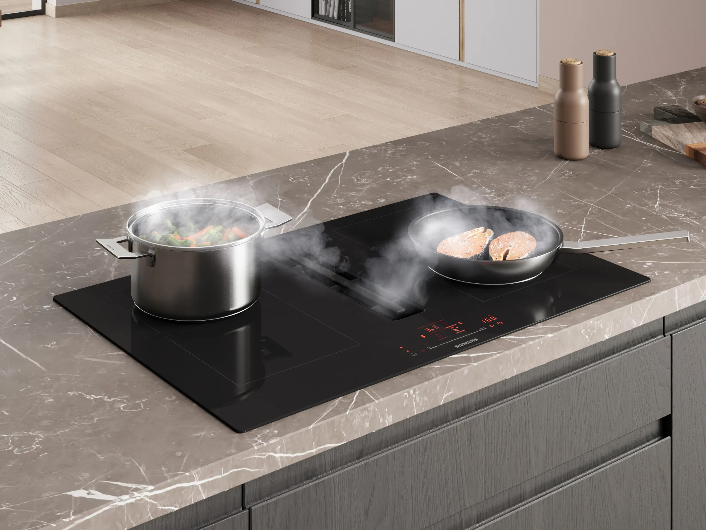 Płyta grzewcza z wyciągiem o matowym wykończeniu, z unoszącym się dymem z patelni, na której smaży się mięso i warzywa.