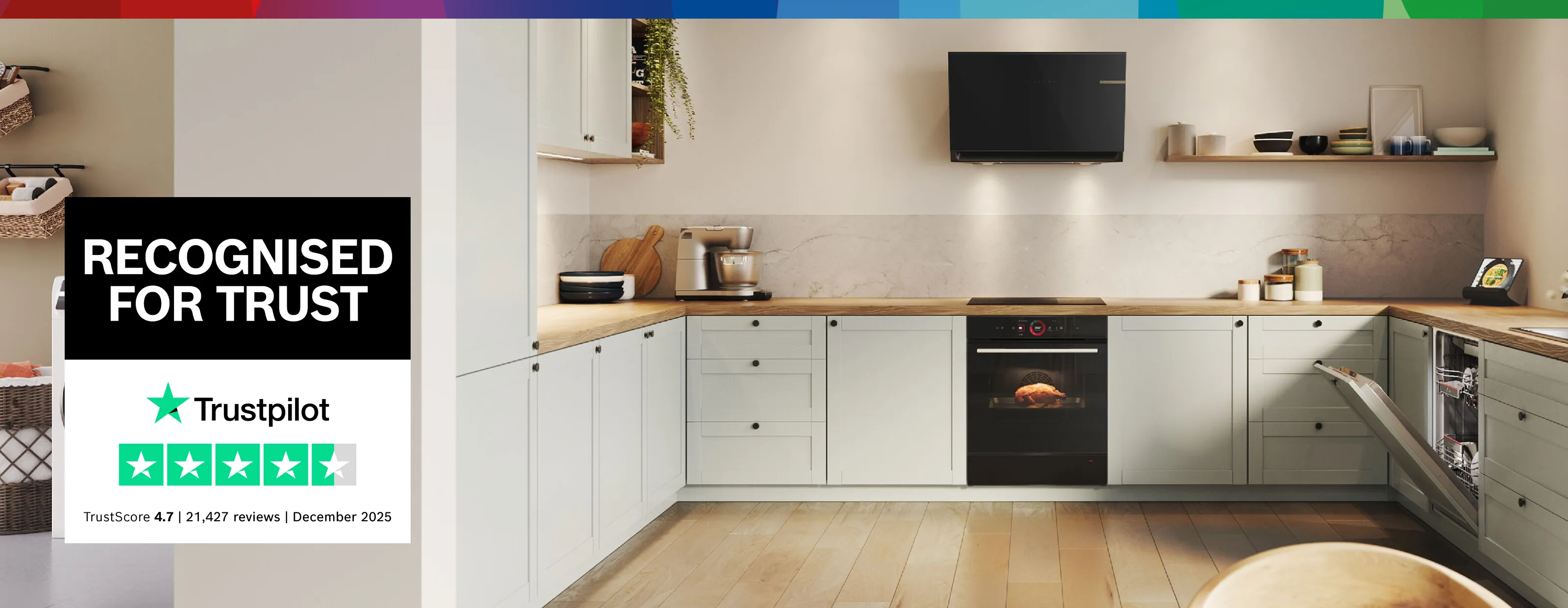 A modern kitchen with light grey cabinets, wooden countertops, and integrated Bosch appliances, including an oven with food baking inside and an open dishwasher, with a "Recognised for Trust" Trustpilot badge overlaid.