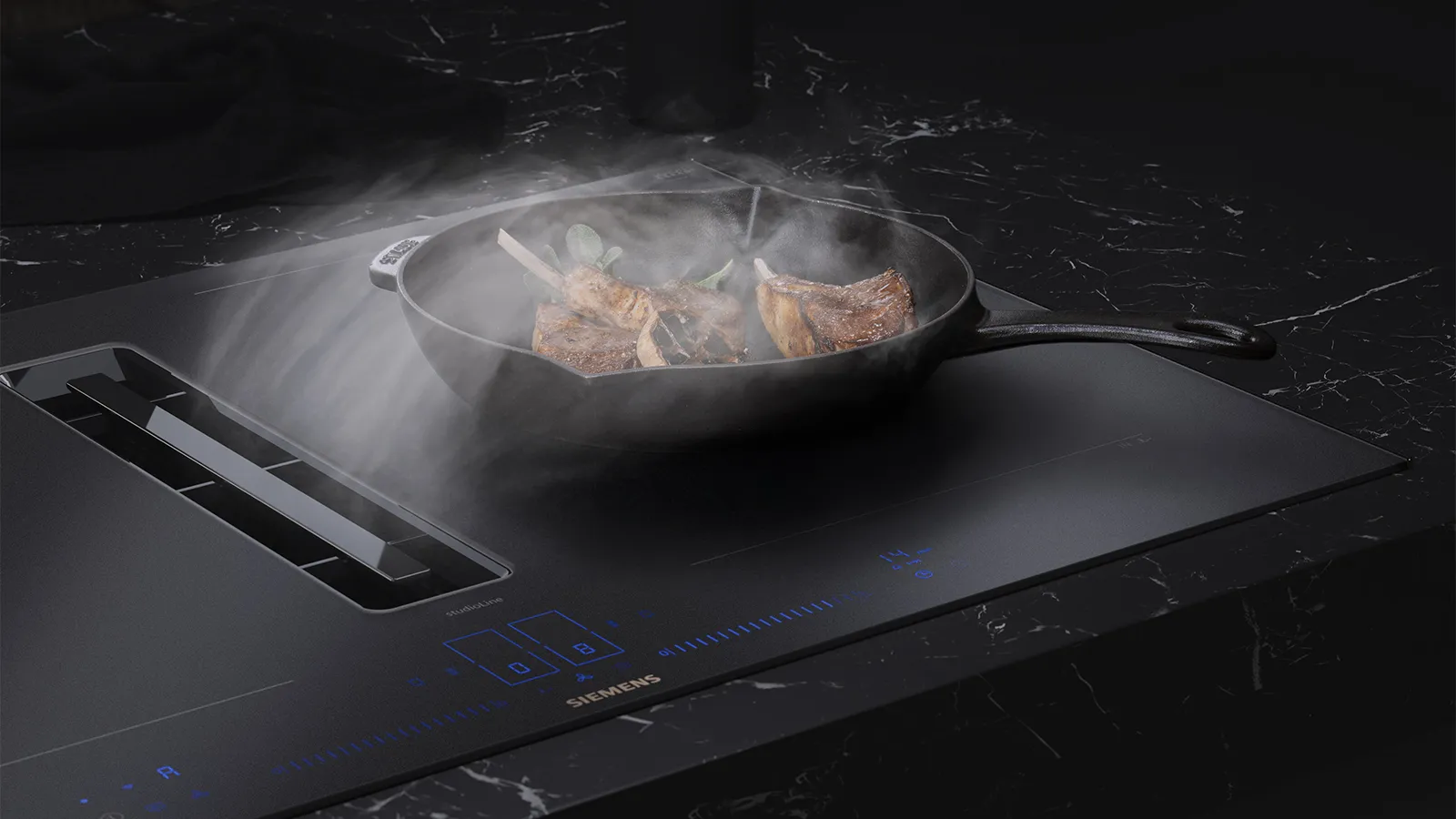 Matt black hob with pan cooking and steam being extracted