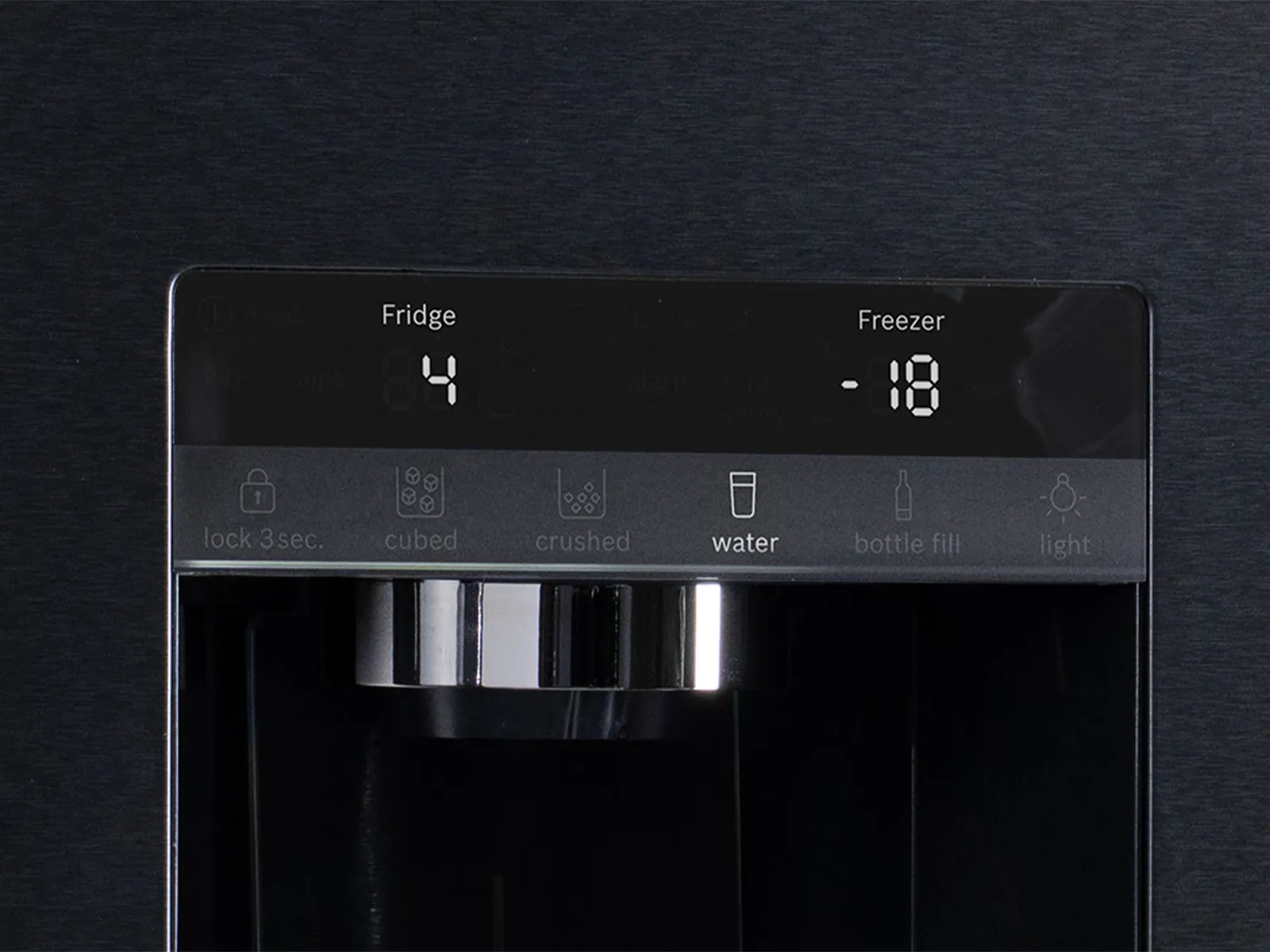 Close-up of a refrigerator’s Ice Water Dispenser digital control panel showing fridge and freezer temperatures and dispenser options.