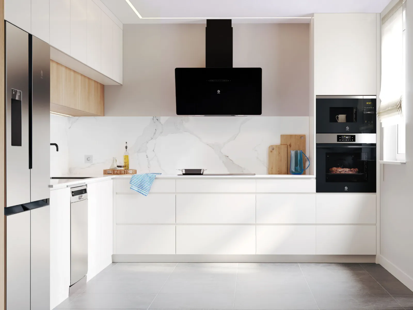 Cocina clara y luminosa con campana extractora inclinada negra de Balay, encima de una placa negra