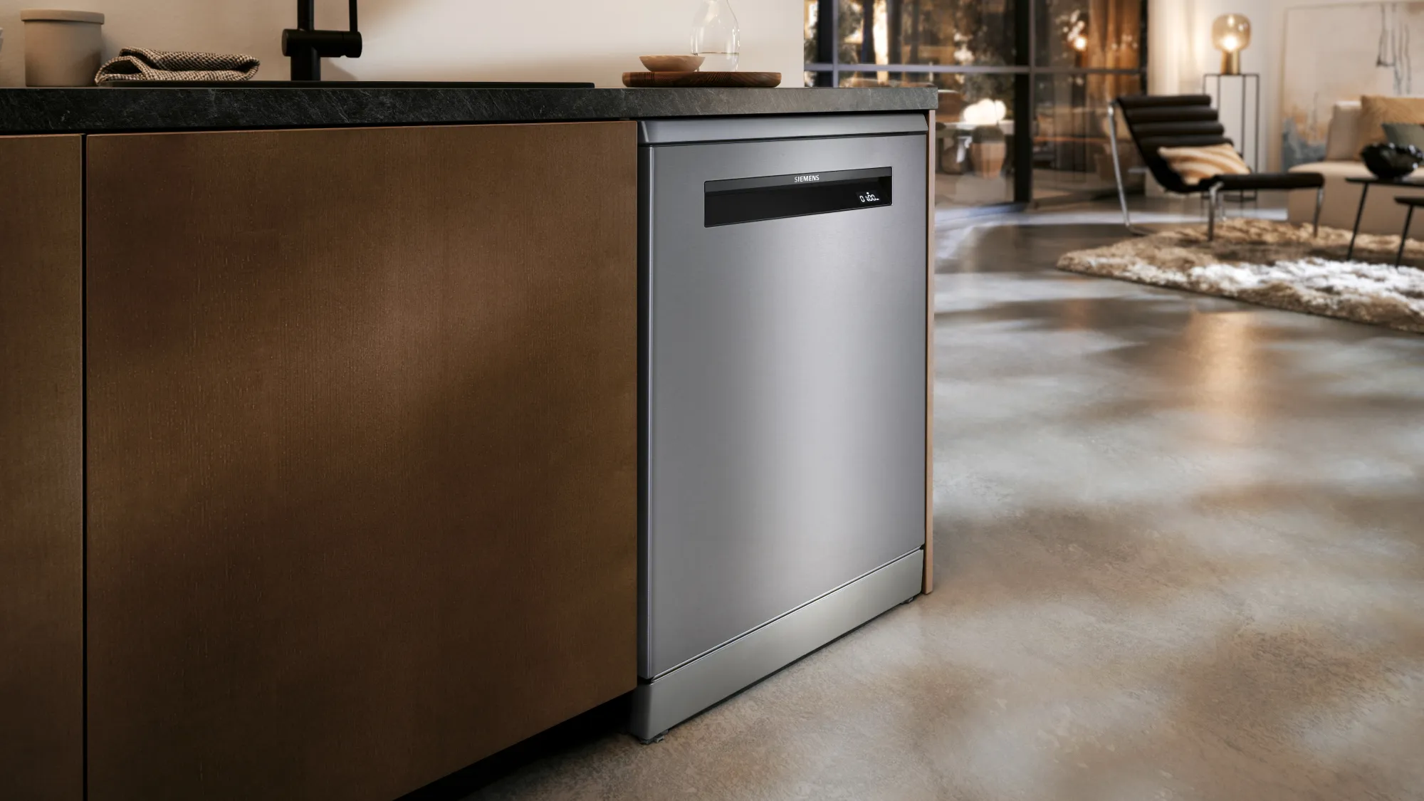 A closed Siemens dishwasher integrated into a modern kitchen.