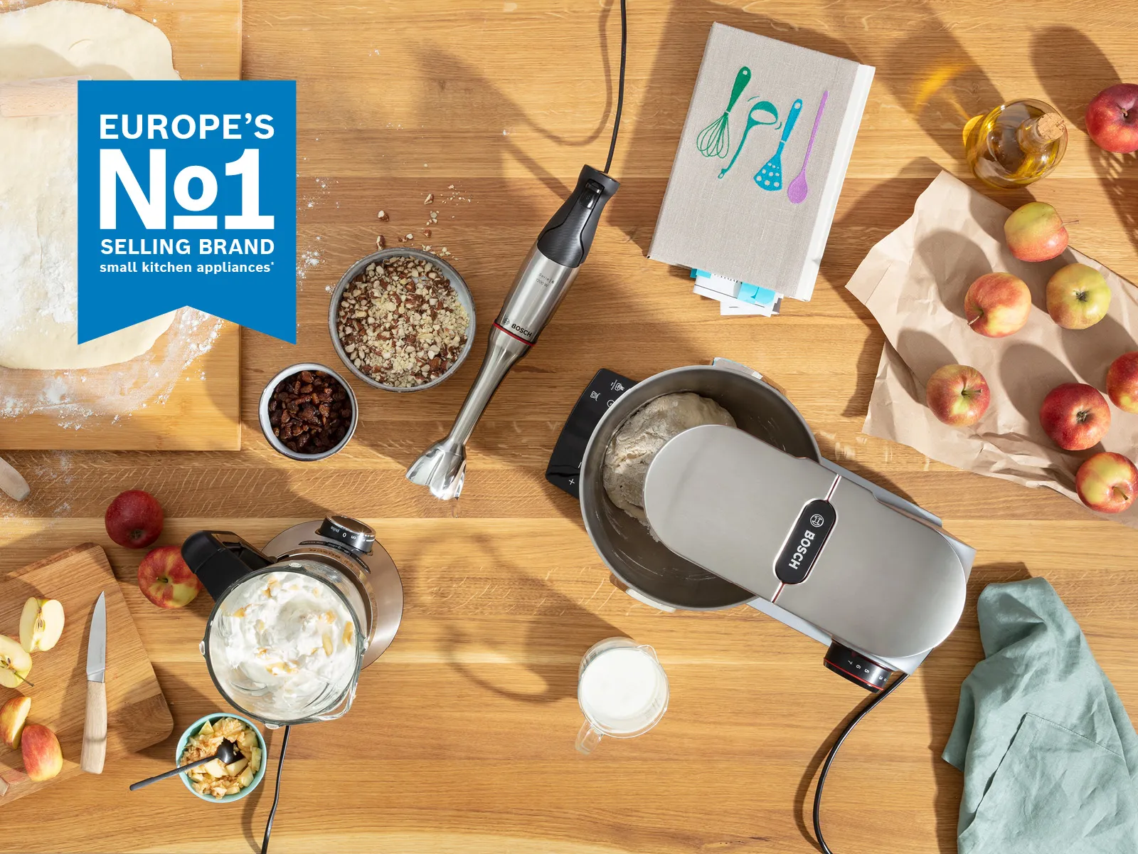 Europe's No.1 brand for food preparation appliances displayed over a table filled with vibrant dishes, desserts, and drinks.