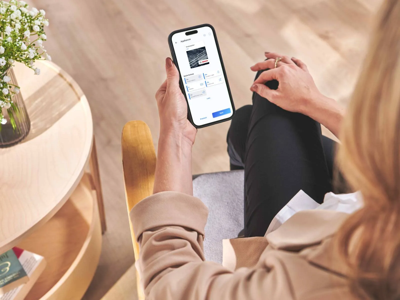 Person using the home connect app on a smartphone