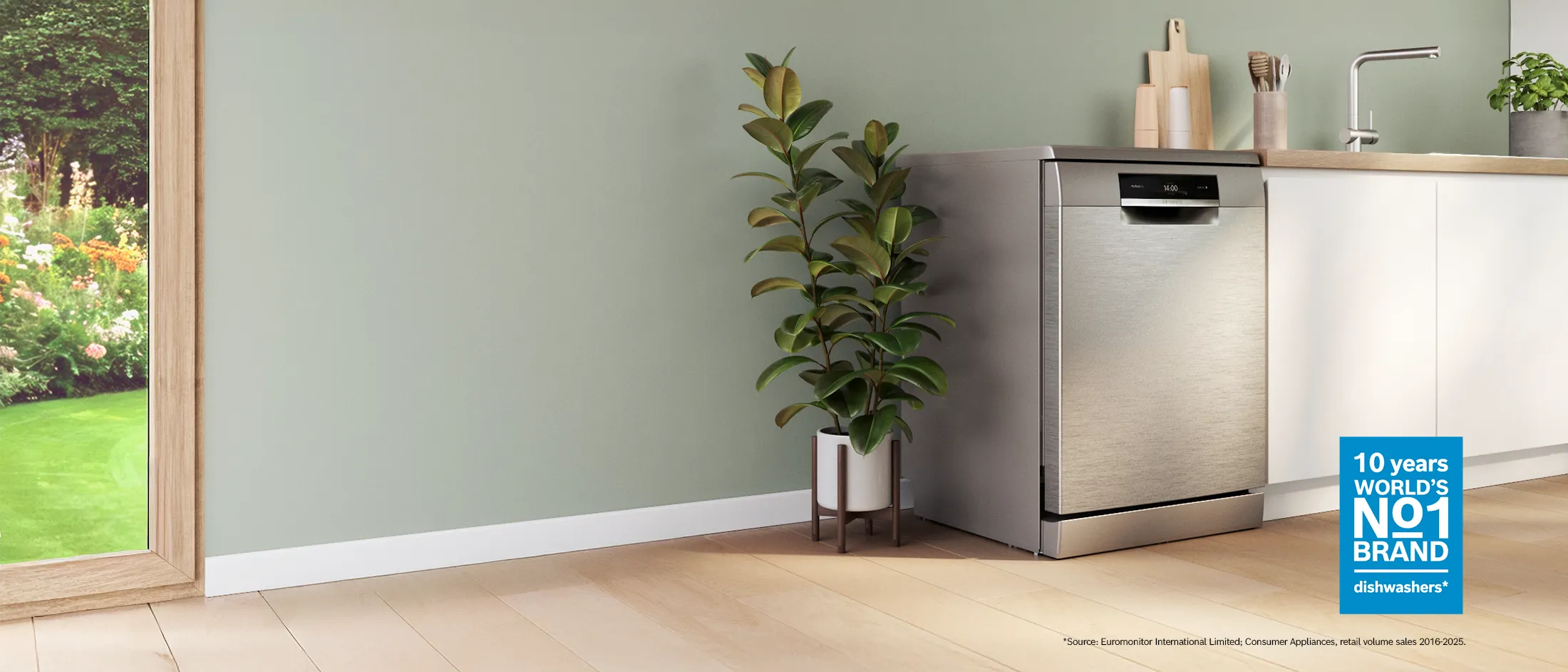 Modern kitchen featuring a sleek dishwasher, wooden countertop, and white cabinetry.