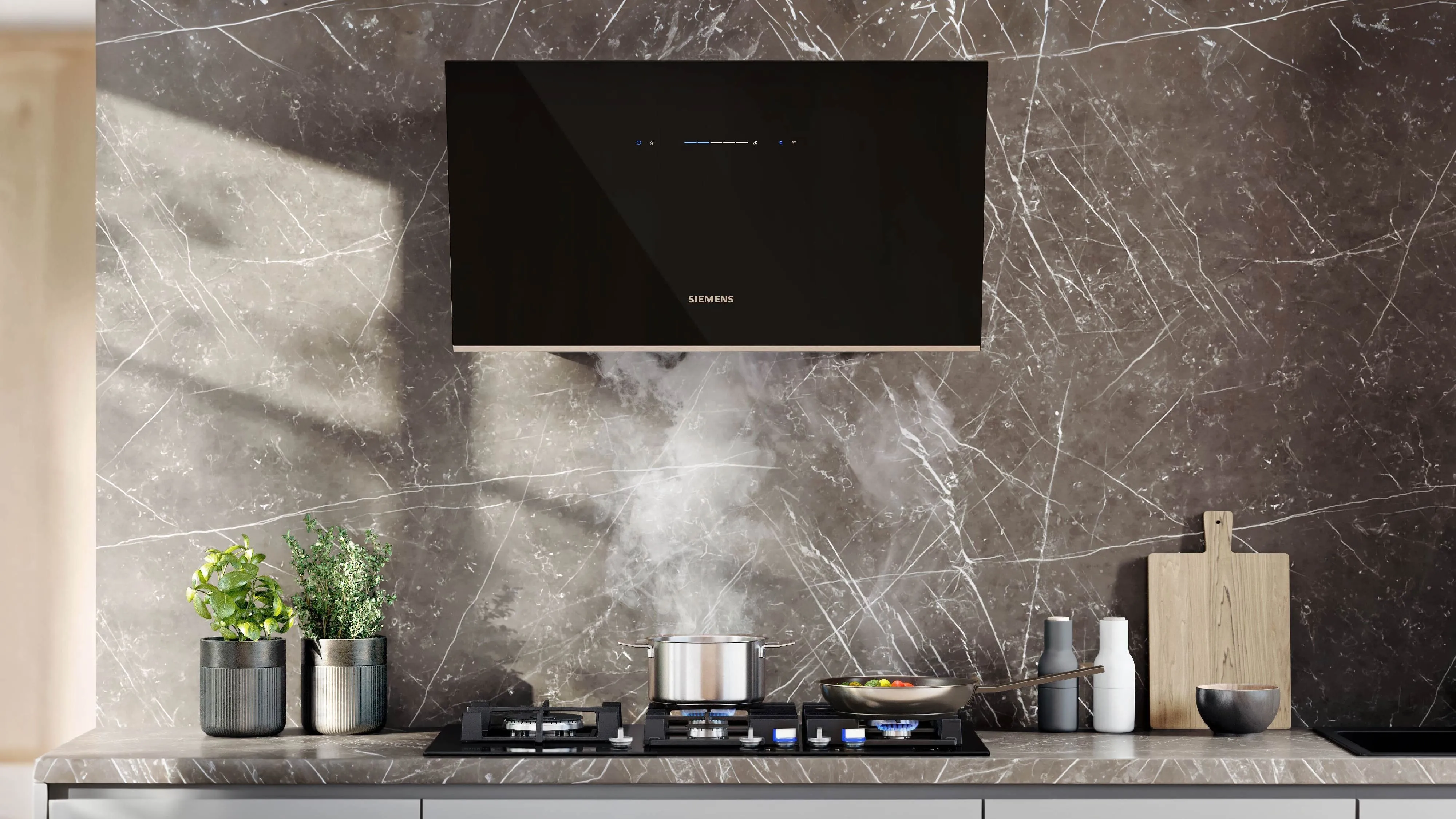 Modern kitchen with island cooktop, dining area in the background, and subtle lighting.