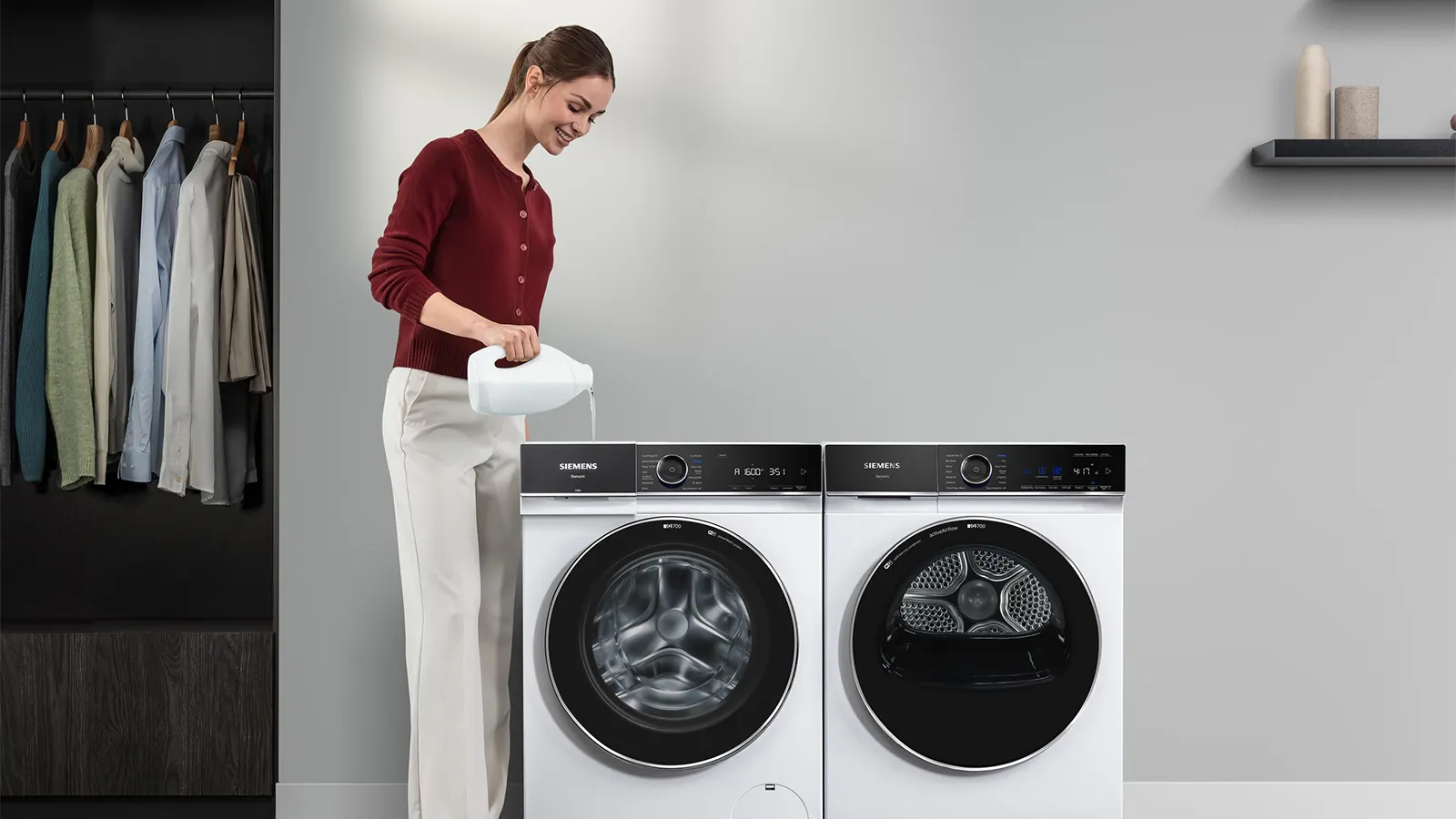 woman adding laundry liquid to the i-dos container of a washing machine