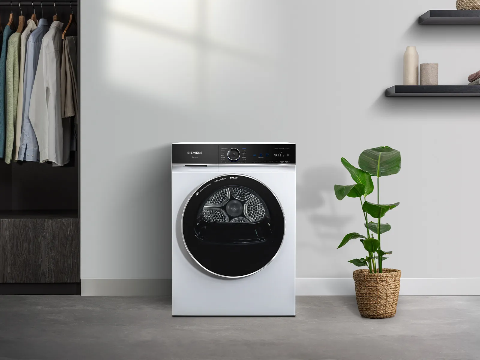 Woman carrying laundry basket to washing machine