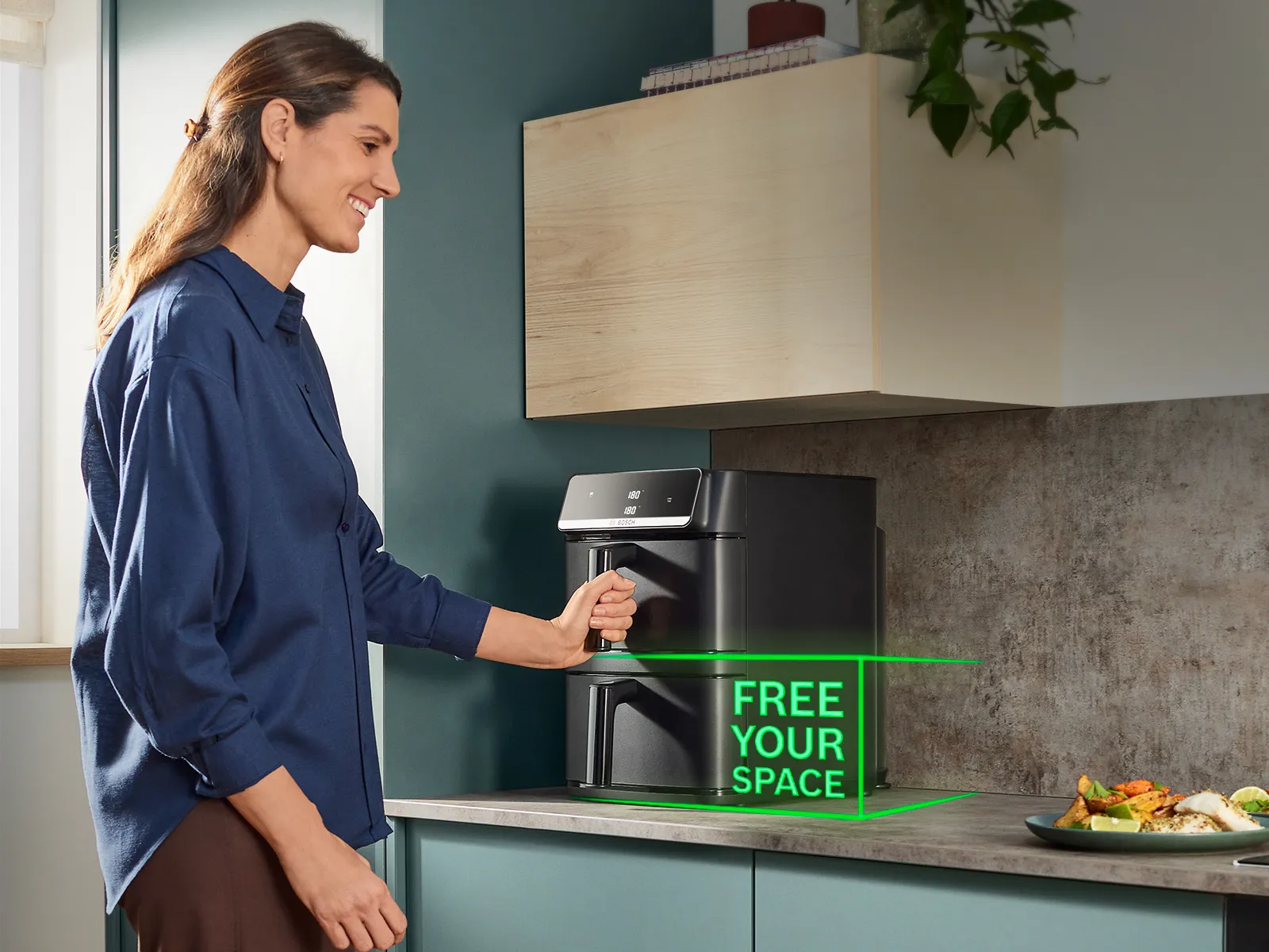 The Bosch Series 6 Double Stack Drawer stands on a kitchen counter and fits perfectly under a kitchen cabinet.