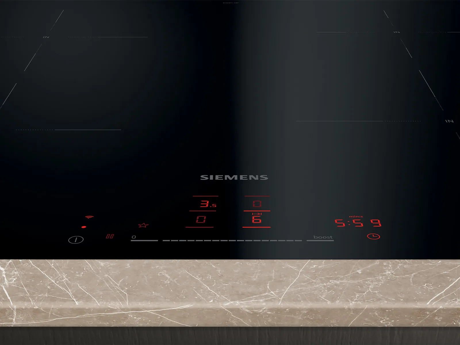 A black Siemens induction cooktop with red digital controls displaying cooking settings and a timer, integrated into a light marble-patterned countertop.
