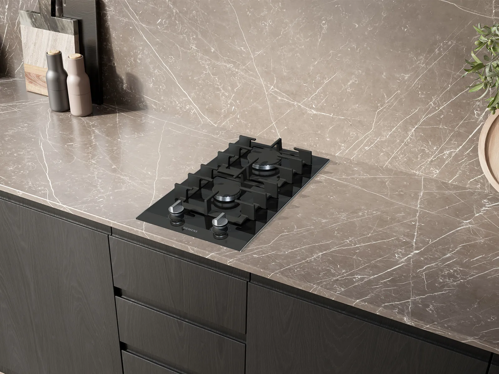A sleek black Siemens gas hob with two burners and control knobs, integrated into a dark marble-patterned countertop in a modern kitchen.