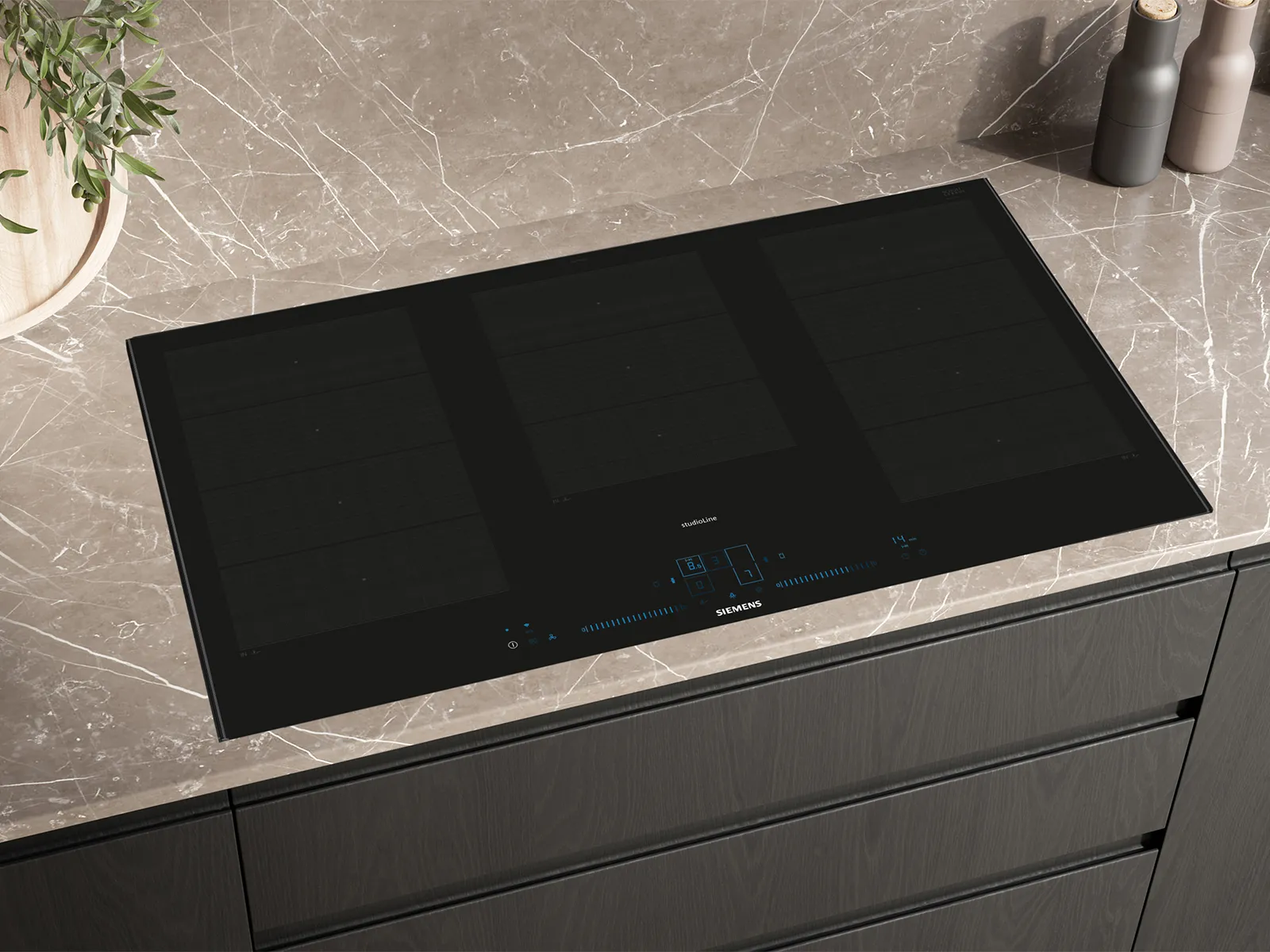 Black glass cooktop on wooden cabinet.