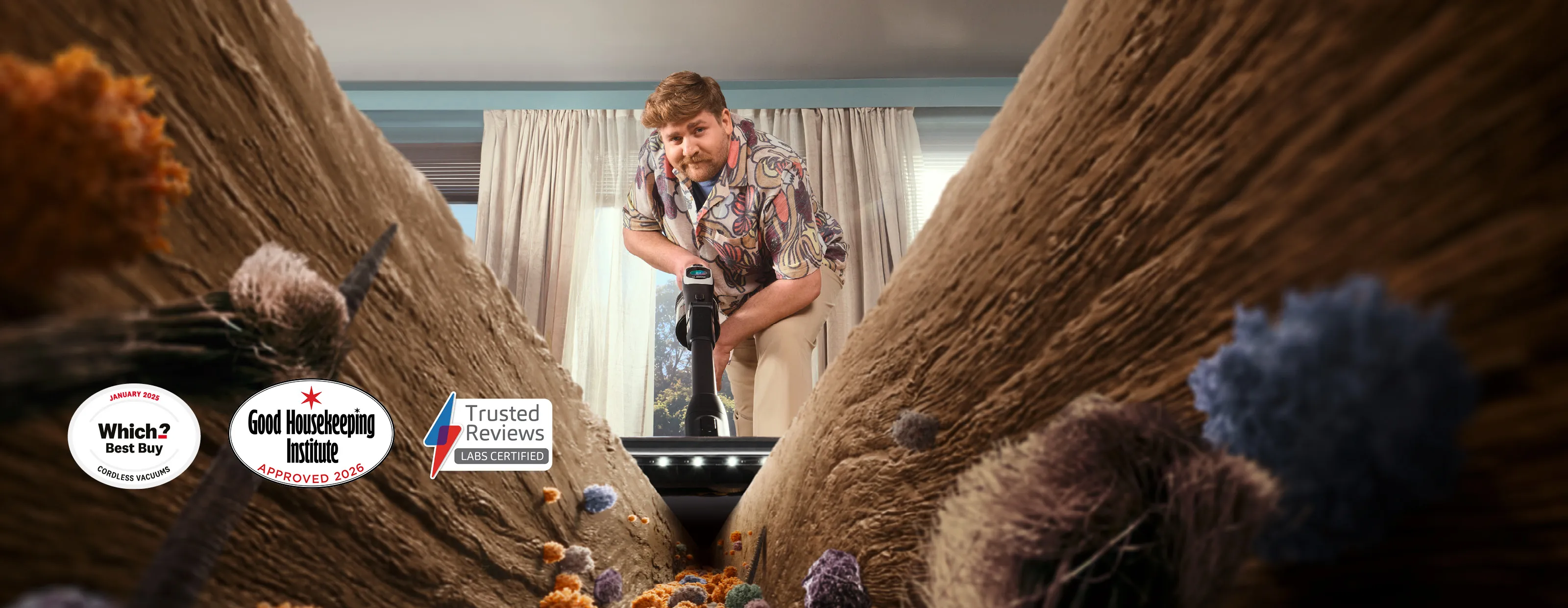 Person using unlimited 10 vacuum cleaner with multiple award icons overlay