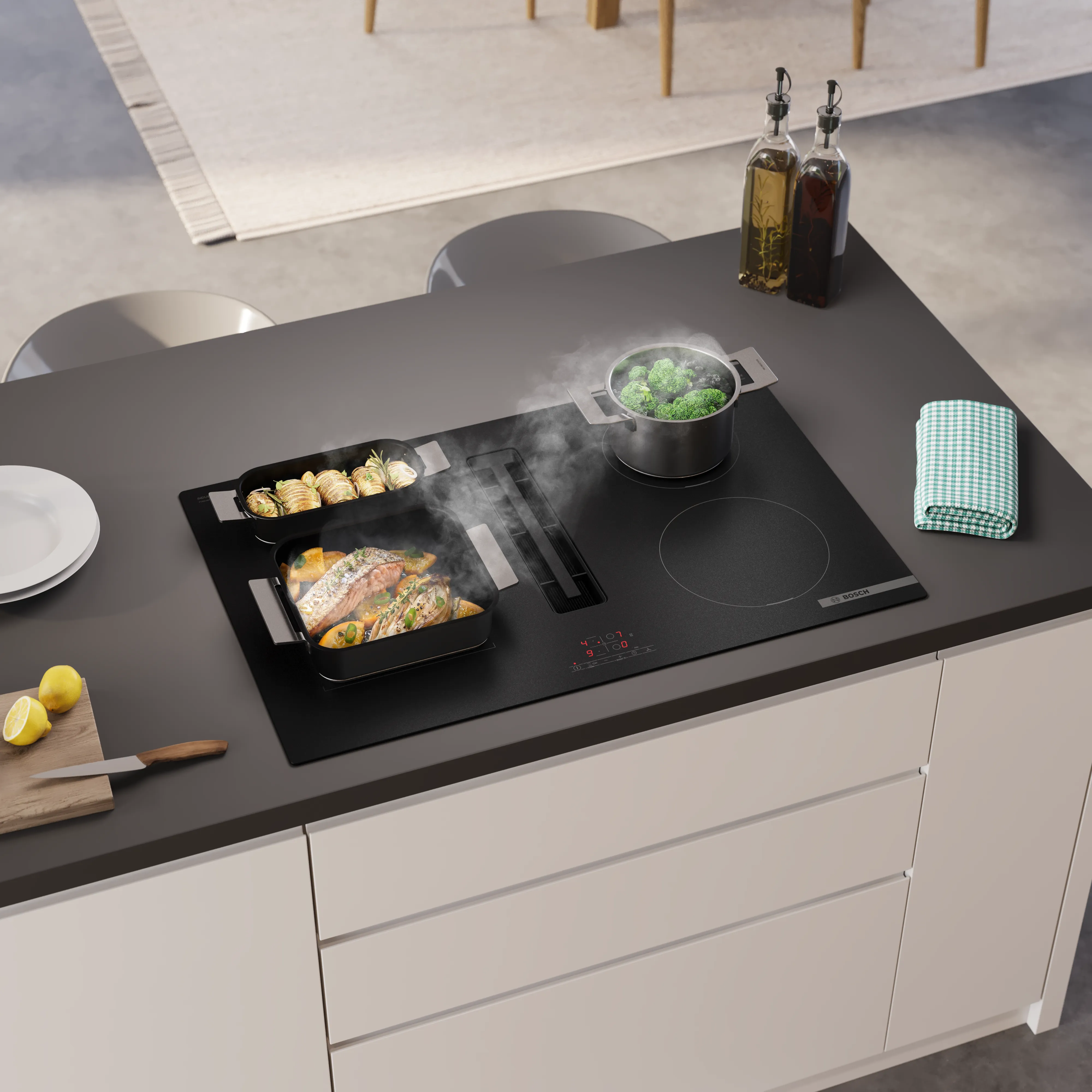 Bilden visar Bosch induktionshäll med inbyggd fläkt i Matt Design, harmoniskt integrerad i köksbänken.