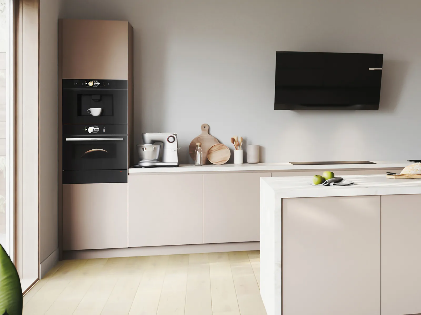 Modern kitchen featuring sleek beige cabinets, built-in black appliances, a coffee maker, and a marble-topped island with green apples.