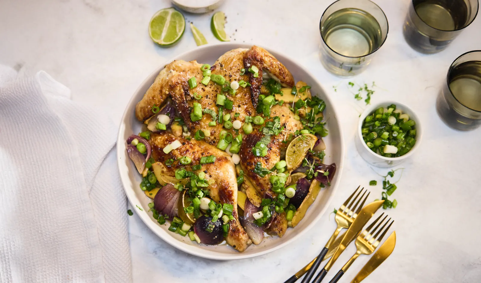 Tender chicken served in a bowl with ginger and spring onions.