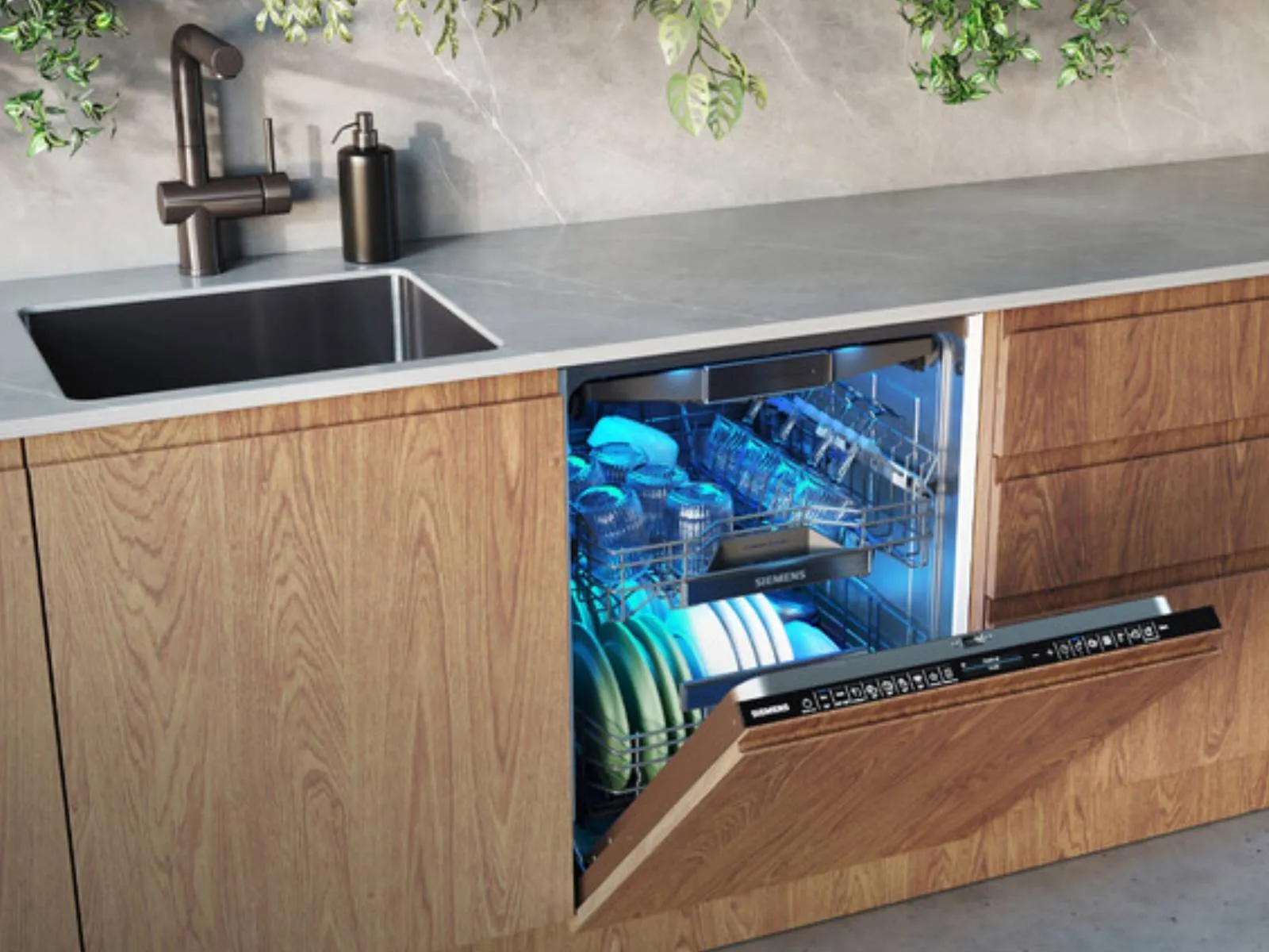 Siemens dishwasher with door slightly open showing interior.