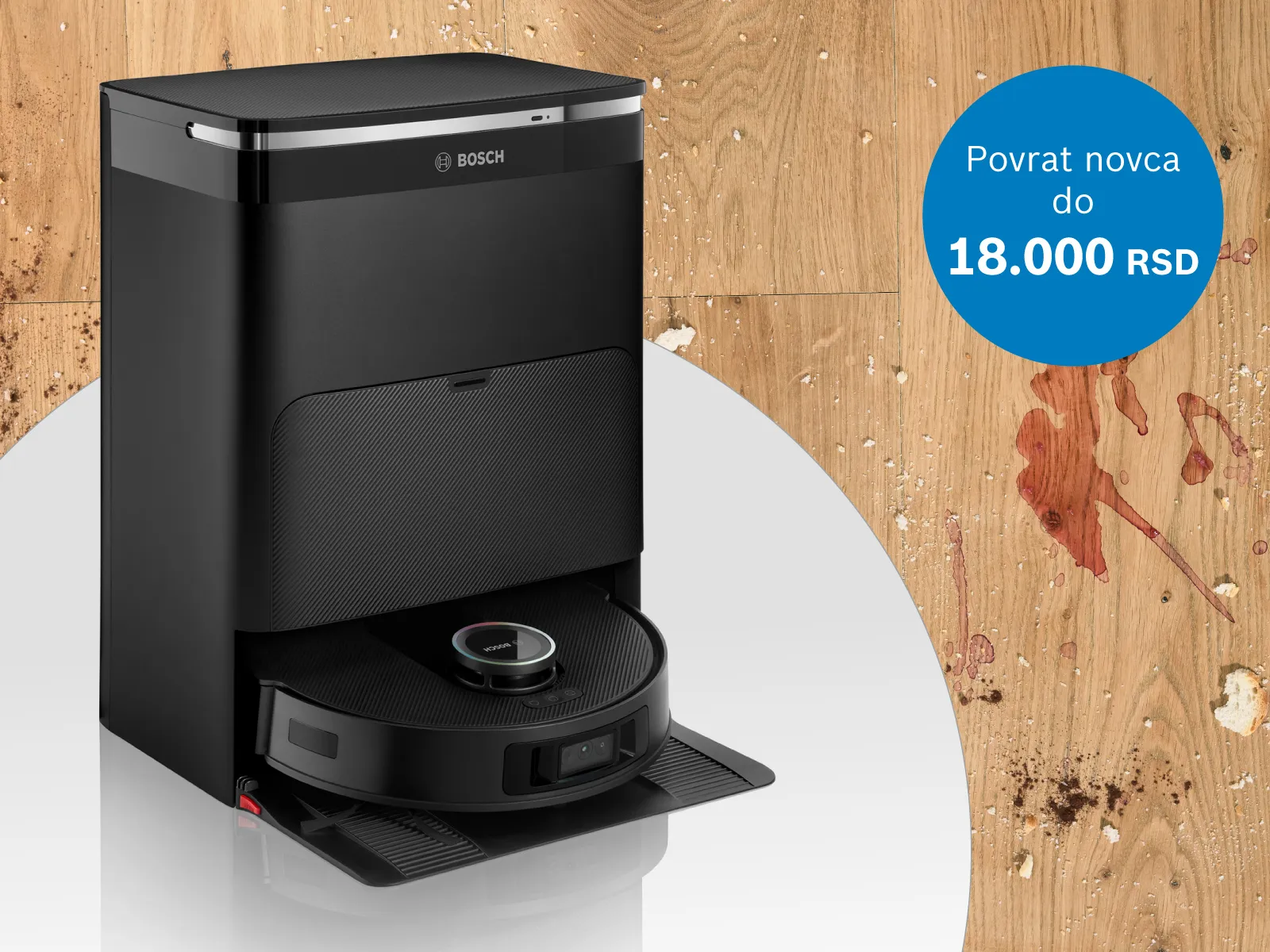 Robot usisivač ispred zaprljanog poda.