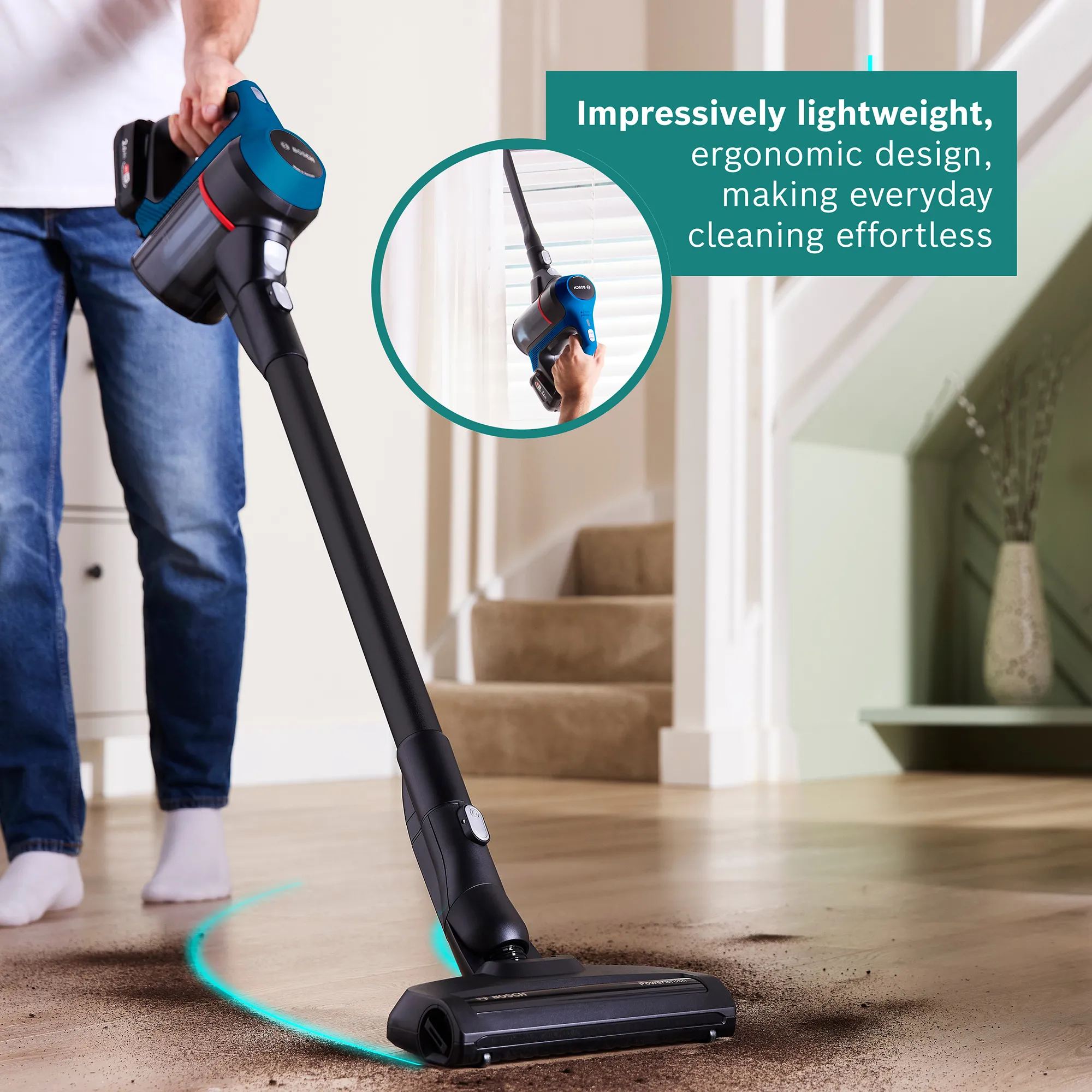 A person vacuums dirt on a wooden floor with a lightweight Bosch cordless vacuum cleaner, highlighting its ergonomic design and ease of use.