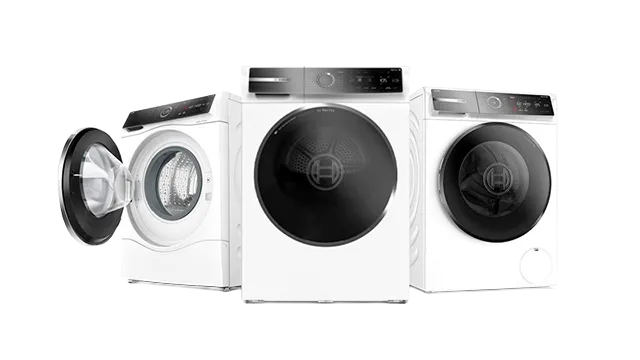 Three white Bosch front-loading laundry appliances, one with an open door.