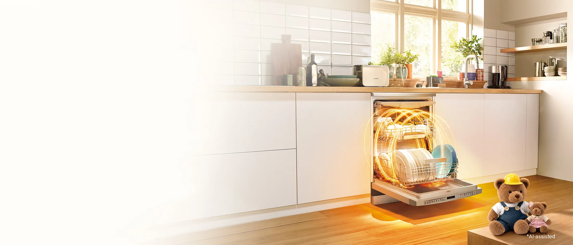 A modern kitchen featuring an open dishwasher loaded with clean dishes.
