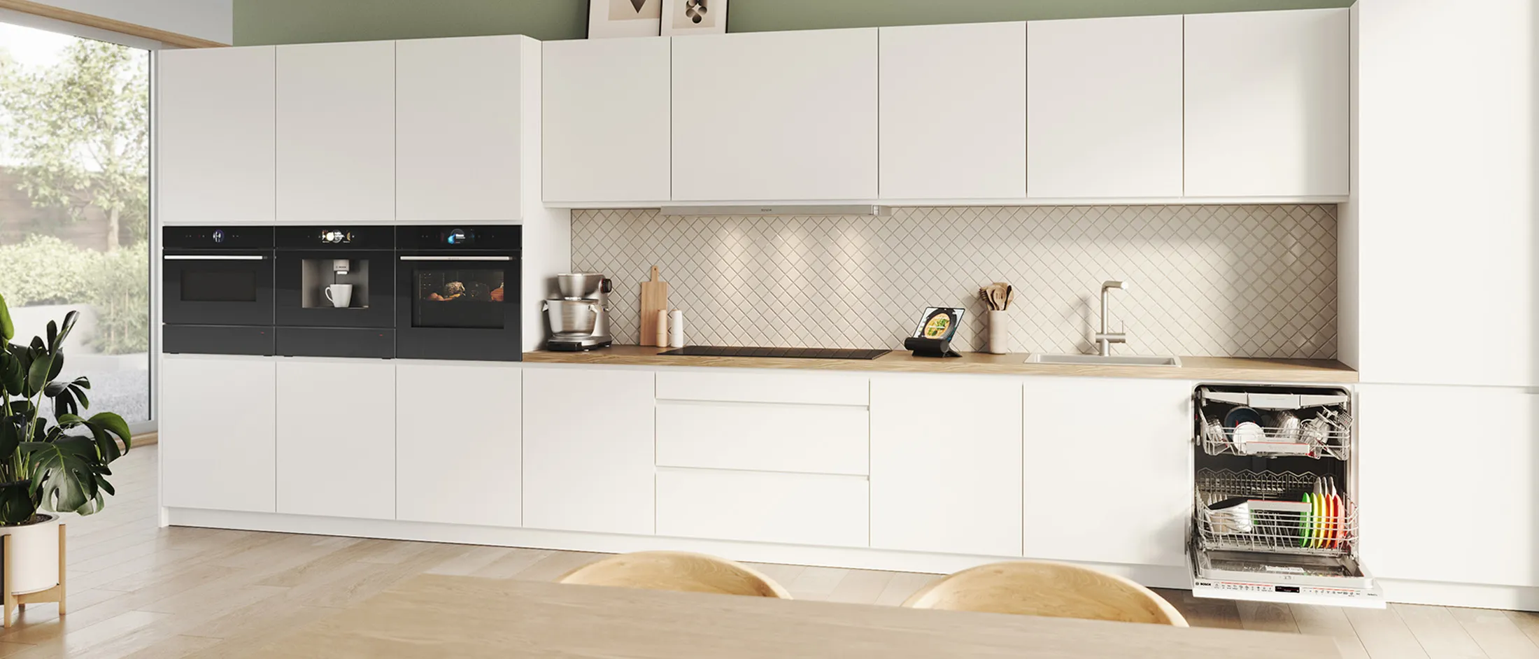 Modern kitchen countertop with stainless cookware on stovetop, blue tile backsplash, wood boards, potted plant, cleaners and an egg basket plus badge.