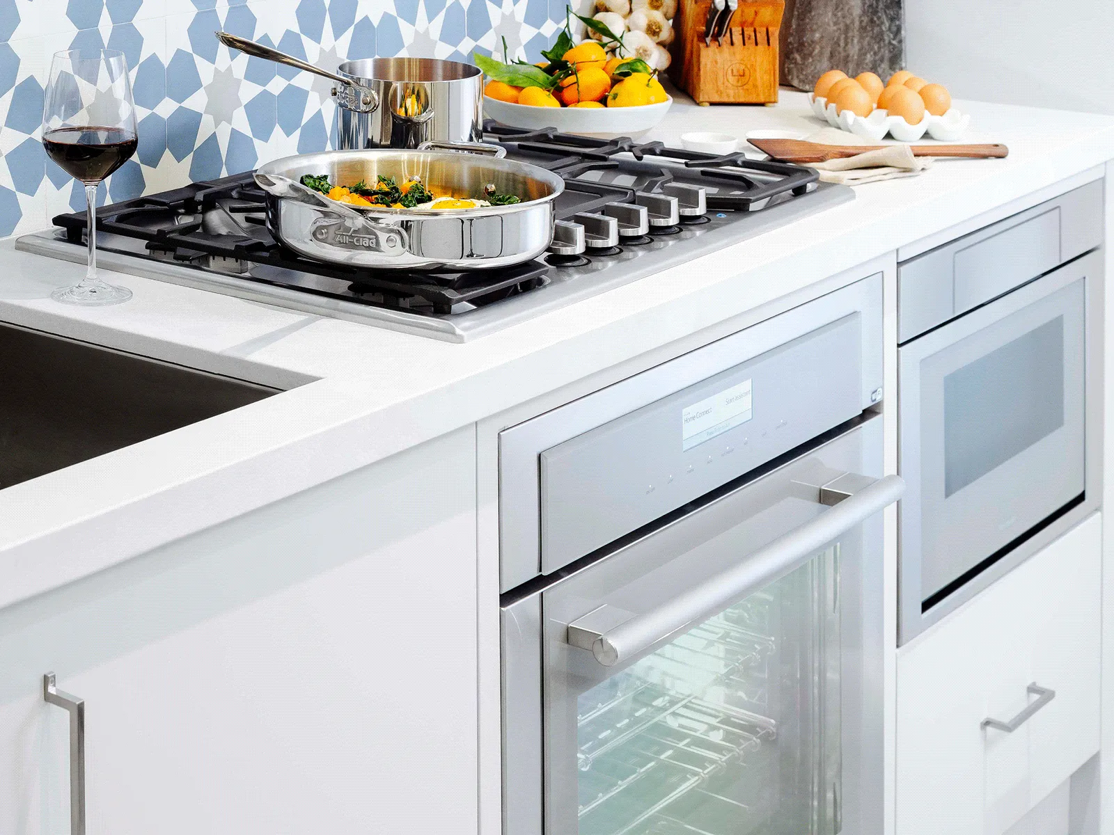 Modern kitchen with stove, oven, and microwave.